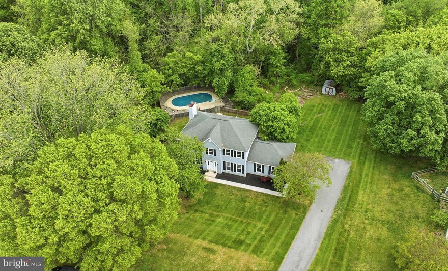 Welcome home to this beautifully renovated home, updated in 2024, situated on over an acre in sought-after Dunkirk. Step inside to a welcoming foyer with a coat closet and luxury vinyl plank flooring flowing throughout. Just off the foyer, French doors open to a spacious office with a ceiling fan, while the formal dining room features updated lighting, perfect for both everyday living and entertaining! The main level opens into a tastefully updated kitchen with quartz countertops, a center island with additional storage and butcher block, stainless steel appliances, pantry, a breakfast nook, and a window overlooking the backyard. The kitchen overlooks the family room with recessed lighting and a cozy fireplace. Off the family room, a sliding glass door leads to the sunroom, with steps down to the fenced backyard and pool area... ideal for indoor-outdoor living! Upstairs, the primary bedroom offers a comfortable retreat with a walk-in closet and an en suite bath complete with a soaking tub, walk-in shower, and double vanity. Nicely sized bedrooms #2, #3, and #4 all have ceiling and share a hallway bath with a double vanity. The fully finished basement expands your living space with a large rec room, wet bar, full bathroom, and a versatile bonus room... perfect for entertaining, guests, or even a home gym! Outside, enjoy a spacious yard and a fenced-in, in-ground saltwater pool with a new liner and full system installed in 2024... all perfectly ready for you to enjoy right before summer! Schedule your showing today!