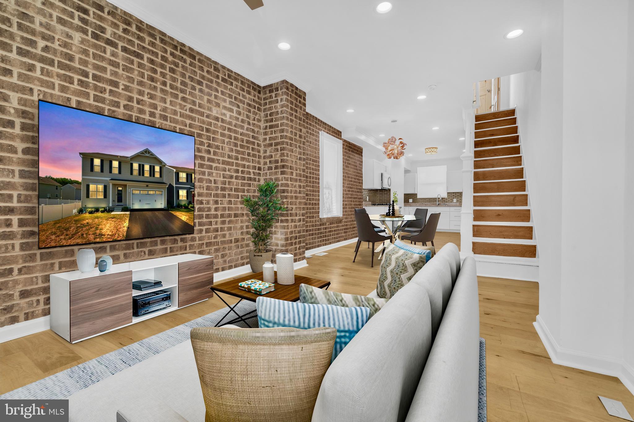 Welcome to this beautifully renovated 2-bedroom, 1-bathroom end-unit home that blends modern upgrades with classic charm. Enjoy the warmth of hardwood floors throughout and the character of a striking exposed brick accent wall. The updated kitchen features sleek stainless steel appliances and flows seamlessly into the open living space filled with natural light.
Both bedrooms are spacious and equipped with ceiling fans for year-round comfort. The finished basement offers additional living space—perfect for a home office, gym, or media room—along with a separate laundry area for added convenience.
A unique side addition provides extra storage, and as an end unit, you’ll enjoy more privacy and light. Street parking is plentiful, and the location couldn’t be better—just steps away from the park and basketball courts, offering easy access to outdoor fun.
Don’t miss this move-in-ready gem in a vibrant and convenient neighborhood!