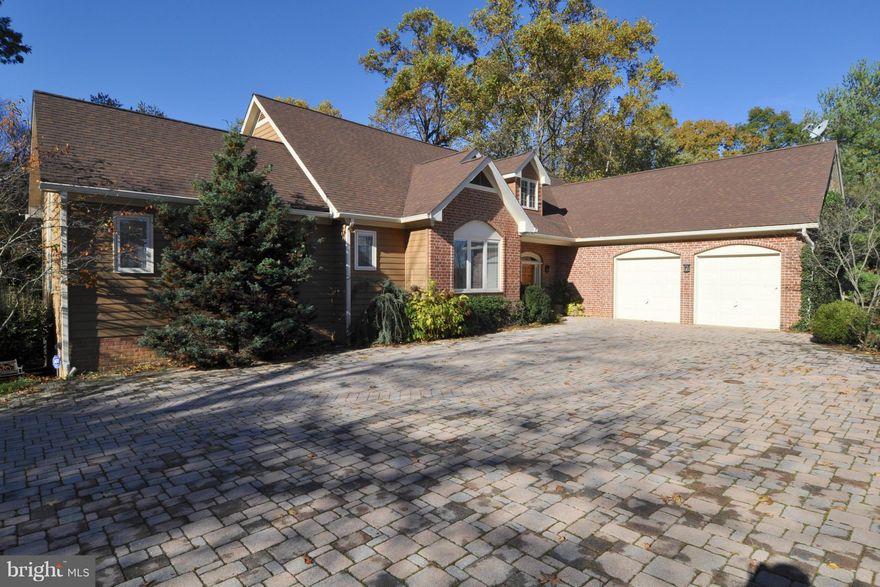 Walls of glass bring the outside into this spacious open layout 4273sqft waterfront home. Many upgrades throughout. Magnificent main-level master, huge bedrooms, hardwoods, walnut/granite/tile kitchen. Cedar plank vaulted great room and large family room perfect for entertaining. Updated mechanicals. Huge decks, pool, private 2-acre oasis, deep water dock on Mill Creek. Ask for 100's of pics/video