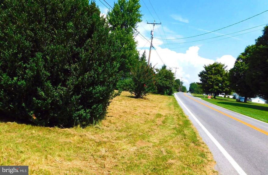 REDUCED PRICE. CITY WATER, SEWER, & UTILITIES ALREADY IN PLACE ON 1.10 UNRETRICTED ACRES+-. HARD ROAD FRONTAGE AND CLOSE TO THE DENT HILL SUBDIVISION,  NEW HOSPITAL & I-70 FOR EASY COMMUTING. JUST A SHORT DRIVE TO THE HISTORIC TOWN OF BERKELEY SPRINGS AND ALL IT HAS TO OFFER.. THIS PROPERTY HAS GREAT VIEWS, LOCATION & CONVIENCE.