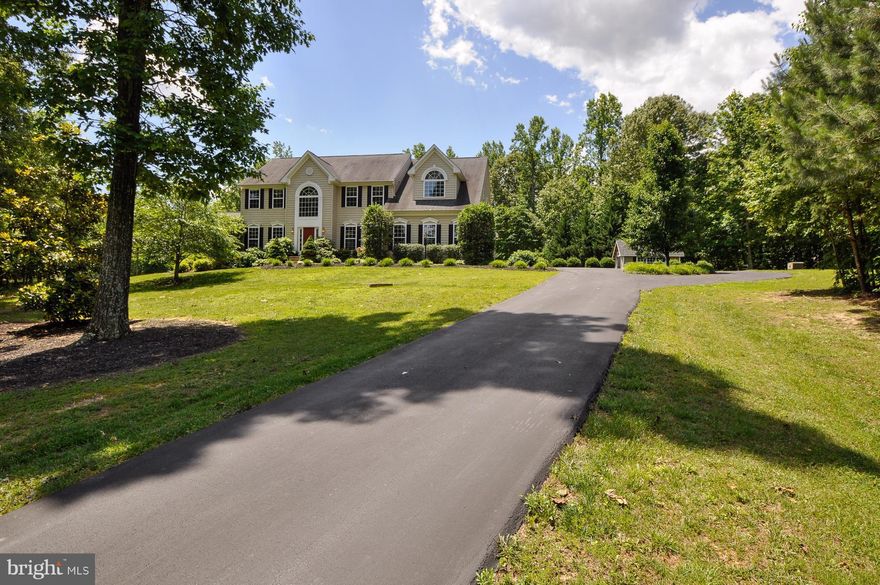 Motivated seller says: Reduce and Sell! Listed  $50K below recent financing appraisal!Turn key with all inspections completed! Estate home on private 10 acres in gated community offers over 6200sqft w/luxury upgrades! Two sunrooms! Gourmet kitchen! Large owner suite w/den & sitting rm! New deck & patio! Leveled backyard! Easy commute to Fredericksburg/Dahlgren! Hurry, won't last at this price!!