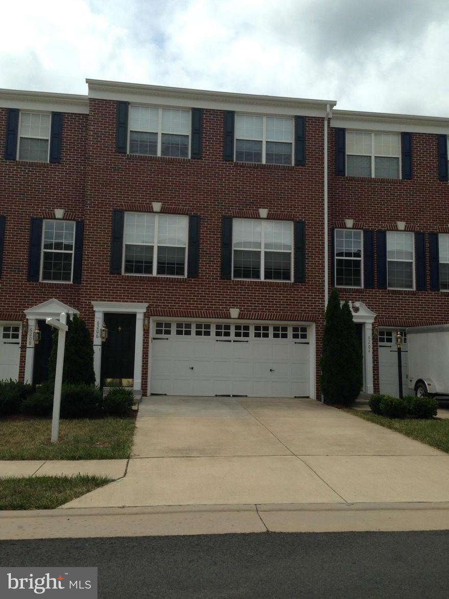 Absolutely immaculate 3 story Townhome with 2-car garage.  Spacious family room with gas fireplace  and wood floor on lower level with bump-out.  Main level has breakfast room with eat-in gourmet kitchen. Separate dining room with tray ceiling.  Large living room.  All main level is hardwood.  1/2 bath on main.  Upper has 3 bedrooms with large owner's suite, vaulted ceiling & spacious luxury bath.