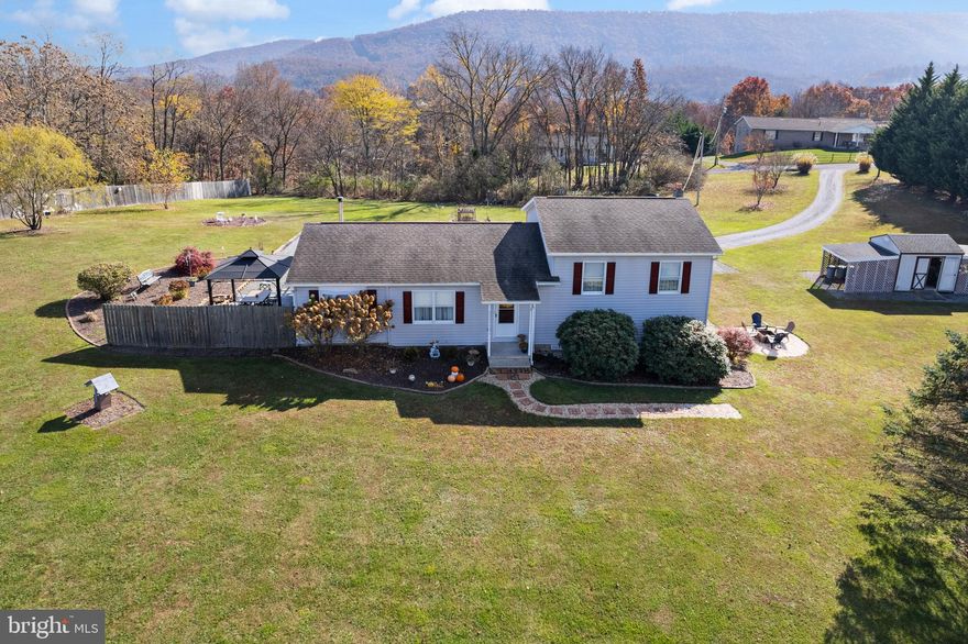Multiple Offers, Highest & Best due by Monday @ 12pm. Private and secluded beautifully landscaped rancher sitting on 2.07 acres. This property has amazing views of the mountains and only 6 miles to downtown Berkeley Springs. No HOA and unrestricted, bring your chickens!!  Plenty of space for entertaining with 2 patios, newer enclosed deck, and firepit.  If cooking is your favorite way to relax, you will love this new upgraded dream kitchen: well-equipped, with plenty of gorgeous granitite counter space, lots of cabinets, new stainless-steel appliances, new light fixtures, and beautiful new LVP flooring throughout the whole house. New patio door was just installed this year and new interior doors throughout the house. Walk down to the basement and enjoy the nice spacious area that could be used as a 4th bedroom, game room or family room.  Also, in basement there's a new water softener and a rough in for a possible 3rd bath.  2010 Husqvarna 48-inch riding mower will convey with the property.