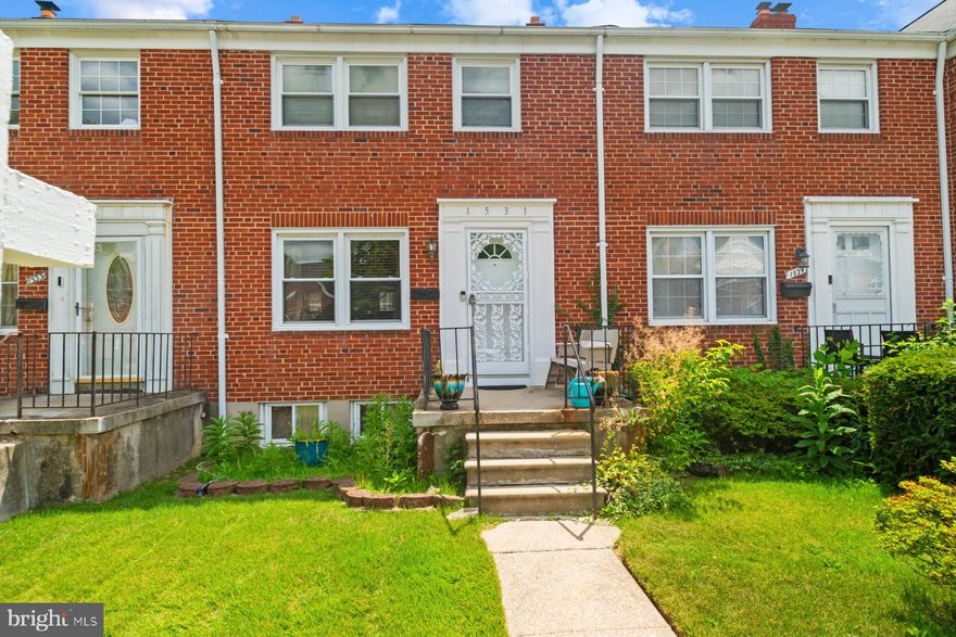 Move-in ready 3BR/1BA brick Townhome located on a quiet street in Edmondson Heights.  Make your way past a lush green lawn on the way to the front porch of your forever home.  Step inside a home filled with natural light and beautiful hardwood floors.  The main floor living space offers a spacious living room, sizable dining room, and kitchen.  The kitchen features plenty of wood cabinets, stainless steel appliances, and a deep stainless sink.  On the second floor are two sizable secondary bedrooms, a large primary bedroom, and a full bath.  The lower level offers additional living space, laundry, storage, and a walk-out to the semi-fenced yard.  From the kitchen step outside onto a newly constructed wood deck that overlooks a yard with green space and off street parking.  This home is ideal for any new homeowner and is located in close proximity to shopping, restaurants, and commuter routes.