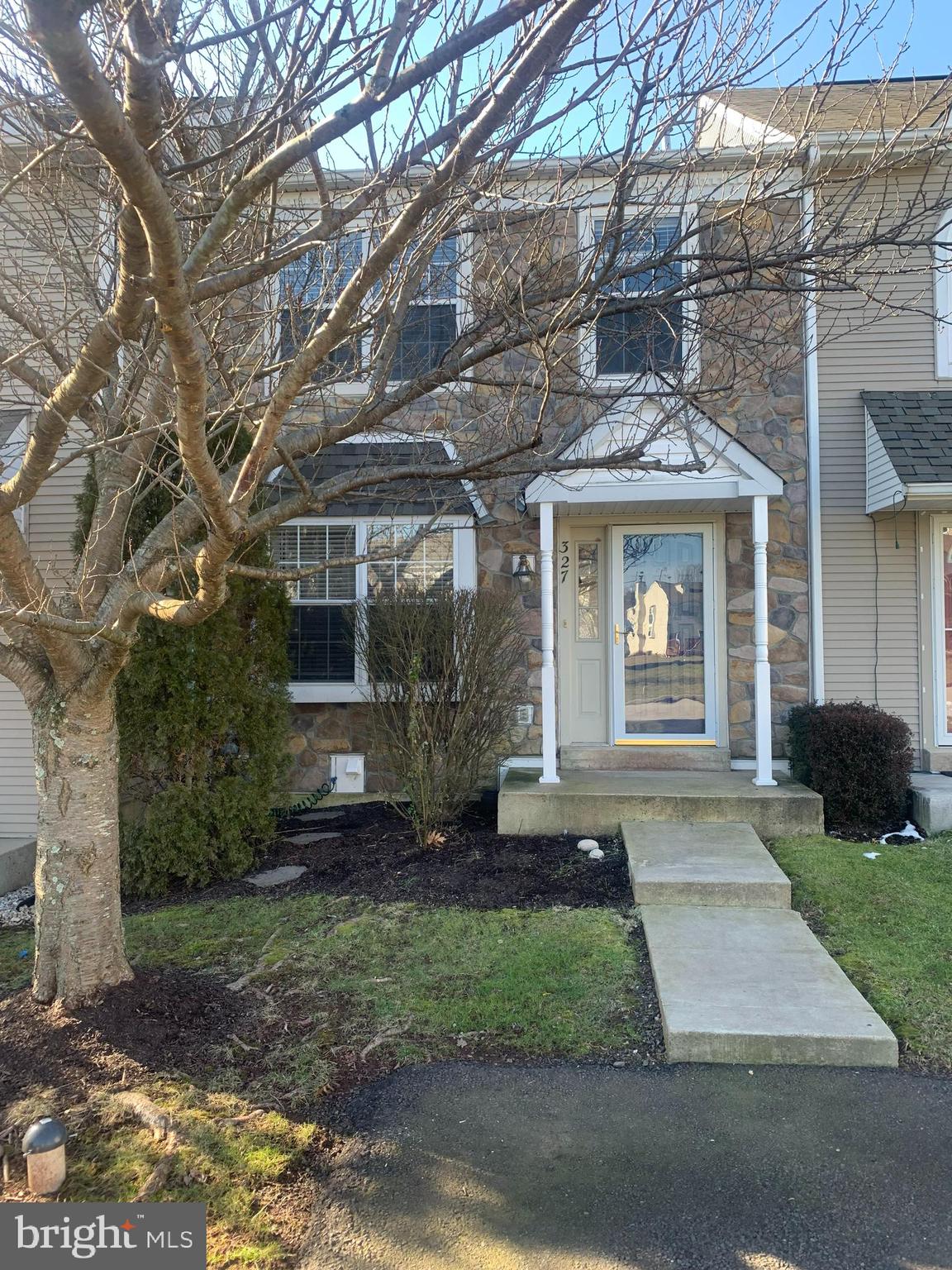 This stunning stone-front townhouse in the highly sought-after Cranberry Estates is move-in ready! The inviting open-concept main level features a spacious Living Room with a charming bay window, seamlessly flowing into the adjoining Dining Room—both boasting brand-newer flooring—creating the perfect space for entertaining family and friends. The expansive Kitchen shines with granite countertops, ample cabinetry, and counter space, as well as stainless steel appliances. A convenient pantry and a bright breakfast area with sliding doors lead to the rear deck, where you can enjoy serene, private views of lush trees. Completing the main level is a guest bathroom and a coat closet. Upstairs, French doors welcome you into a massive Owner’s Suite with newer carpet, two double closets, and an en-suite bathroom featuring a vanity and a tub/shower combo. Two additional generously sized bedrooms with ample closet space share a well-appointed hall bathroom, complemented by a linen closet for added storage. Every room has been upgraded with new overhead lighting and ceiling fans! The walkout basement, offering ample storage space, hosts the washer and dryer and presents an ideal flex space—perfect for a home gym, recreation area, or extra storage. Sliding doors provide direct access to the rear patio, extending your living space into the peaceful, wooded backyard. Enjoy the privacy of your outdoor oasis, complete with a patio, a wood deck, and a grassy area for relaxation and play. Additional highlights newer flooring throughout, updated lighting in most rooms, and ceiling fans. Ideally located in the award-winning Perkiomen Valley School District, this home is within walking distance to Evergreen Elementary and offers easy access to shopping, dining, and major routes including 113, 422, and 29. Ready for immediate occupancy. Don’t miss out on this incredible opportunity—schedule your tour today!