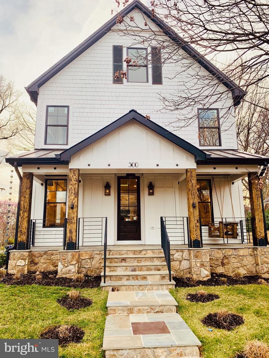 This amazing Modern  Farmhouse is an oasis in the midst of the hippest part of North Arlington. 0.5 Miles from VA Sq-GMU Metro Stations, Clarendon, and Ballston. One of the most walkable neighborhoods in Arlington, VA. The property showcases luxurious finishes, modern Gourmet kitchen with authentic reclaimed barn beams, Quartz waterfall countertop. Professional-style appliances by JennAir. 48" Dual-Fuel Range, built-in refrigerator. The spacious master suite features a custom walk-in closet luxurious bathroom.  Basement highlights Recroom, live wood bar, wine room, media room, and exercise room. Stunning metal railing for interior and exterior stairs, porch, and deck. Sunroom with builtin shelves. 5" Character White Oak floor, trim work, crown molding, spray foam insulation throughout. The landscape comes with a sprinkler system. The builder adorns every inch of this property. Throughout the house, it's all about addition through subtraction.