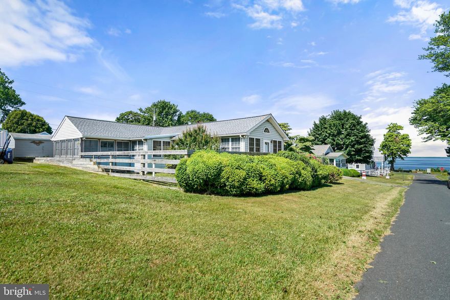 Experience serene waterfront living in this charming 3-bedroom, 2-bath ranch home, ideally situated in a picturesque water-oriented community. This property offers a perfect blend of comfort and convenience, with a range of features designed to enhance your lifestyle.

The spacious living room is perfect for family gatherings and entertaining.  A cozy side family room allows you to enjoy relaxing water views less than a block away.

Outdoor amenities include a side screened porch for enjoying the fresh air without the bugs, a deck ideal for barbecues and outdoor relaxation, an outside shower perfect for rinsing off after a day at the beach, and a shed for extra storage space. The home comes furnished, making it move-in ready. It features an updated roof, an updated HVAC system for efficient heating and cooling, and  gravity septic and well systems for reliability and efficiency.

Located in a close-knit, water-oriented community, residents enjoy easy access to water activities and scenic views. The home is less than a block from stunning water vistas, perfect for evening strolls and morning coffees. Additionally, the community boasts a beautiful beach, providing a perfect spot for sunbathing, swimming, and family picnics.

The property is being sold in its current condition, offering an excellent opportunity for buyers to add their personal touch.