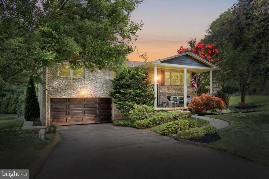 Welcome to this well built brick split foyer in Haines Acres. The main level has lovely hardwood floors throughout most of the main living area. The bathrooms and kitchen have been updated with luxury vinyl plank flooring. The kitchen has stainless steel appliances with ice and water in the front of the refrigerator, 5 burner gas stove, built-in microwave and dishwasher. Both the upper and lower level bathrooms have been updated with new vanities, toilets, tub and shower units, and the main bath upstairs has a laundry shoot. A brick wood burning fireplace in the lower level family room accents the room with it's wall length mantel. The family room has a sliding glass door to the rear yard patio while the garage also has a door to the rear patio area. There is a covered front porch as well as a side deck with pergola for outdoor entertaining. A new roof was just  installed July 2025.