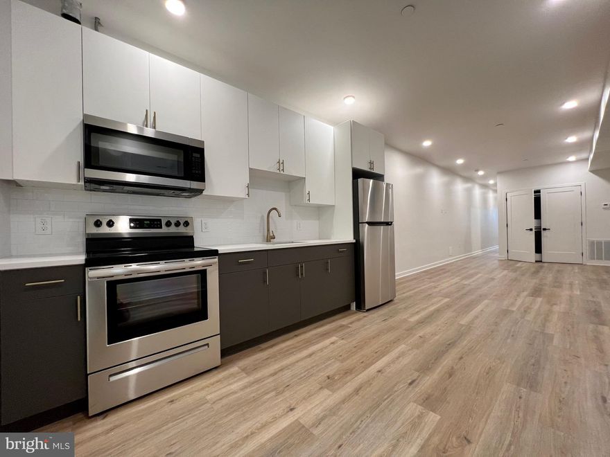 NEW CONSTRUCTION STUNNER - this modern boutique apartment building located on North Broad Street, a short walk from Temple University Hospital, Shriners Children’s, Temple Medical School, and much more. Each unit is equipped with hardwood floors, modern kitchens, stainless steel brand new appliances, washer/dryer in the unit, central AC, keyless entry, building security intercom, matte black finishes, ample closet space, and more! A quick walk to access the Broad Street line, Temple, and Hunting Park, this neighborhood is exploding with new developments and activities. Schedule your tour today for move-in's as early as May 15th. Any lease signed in May will be offered ONE MONTH FREE on a 13 month lease.