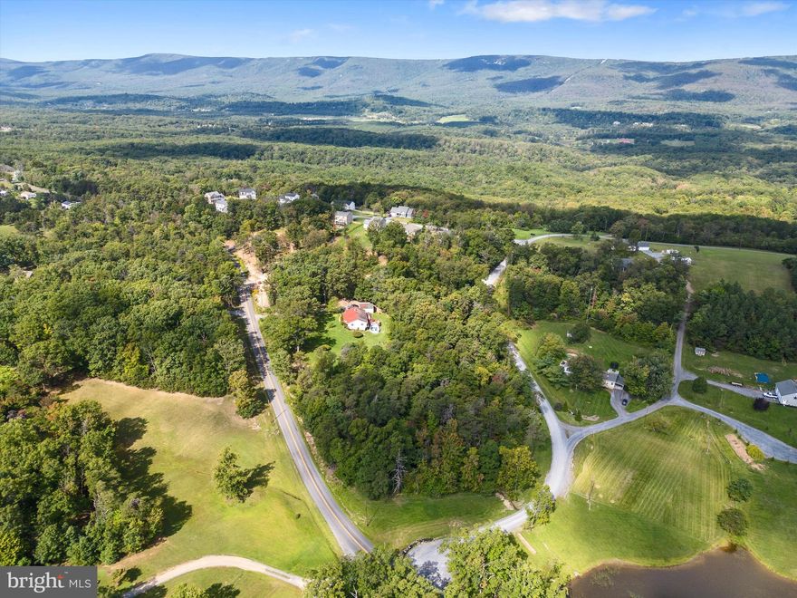 Limited opportunity to pick up a prime building site in a desirable, rural community that is thriving and growing! High View Manor features lovely, new construction with some green space between homes, and mature trees all around. Ready to build lots just minutes from town, perfect for someone who wants to be in a community, but still have some space between neighbors. Lots 2&3 are found on the left just as you crest the hill on Manor Dr and are being sold collectively as one homesite totaling  3/4 of an acre. Only 8 miles to Winchester Medical Center and not on the side of a mountain, you'll love it here! Additional homesites available as well. Perfect opportunity for a builder looking to build in a growing community, or if you're looking to build bring your ideas!