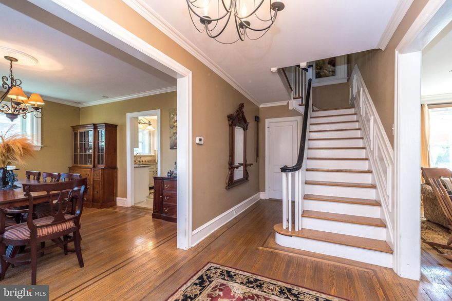As the address implies, this home is situated in the well-known Rosedale retreat of Pottstown Borough, Montgomery County, PA. A side walk-lined street guides the visitor to an in-bloom pink Magnolia tree and flagstone walk leading to this home with a grand porch-covered and railed entry with lead glass sidelights. Inside, a sweeping staircase and inlaid wooden floors capture your attention. To one side is the living room and adjoining sunroom providing ample daylight. The living room has a genuine wood-burning fireplace bordered by Mercer tiles (Moravian Pottery & Tile Works) and 2 sets of French doors that lead to the sunroom. To the other side is a formal dining room. As you will see, crown molding and high baseboard adorn most rooms and a powder room is nestled to the side of the staircase. From the dining room easily enter the tiled kitchen w/ granite counter and stainless appliances. The kitchen leads to a breakfast nook, mudroom and basement. From mudroom, a sliding door provides access to a flagstone patio w/ half wall. From the sliding door, it’s an easy walk to your garage also. Back at the staircase, a turned set of stairs leads to a master bedroom and accompanying tiled master bathroom, tiled hall bathroom, two good-sized bedrooms and a desirable 2nd floor laundry w/ glass door. A second set of turned stairs leads to two other bedrooms on a 3rd floor ! The bedrooms have dormer windows, some eave storage and there’s even a cedar closet. The bathroom is tiled and has a period-clawed bathtub. The basement offers interior, perimeter drain protection, another laundry hookup if desired, a oil-hot water heater and outside entrance. The house is fully air-conditioned and a new roof, siding and windows were installed in 2018. A multitude of retail stores, Pottstown Hospital, The Wyndcroft School, 2 DYI centers and easy access to Rt 422 surround this quaint house and neighborhood.