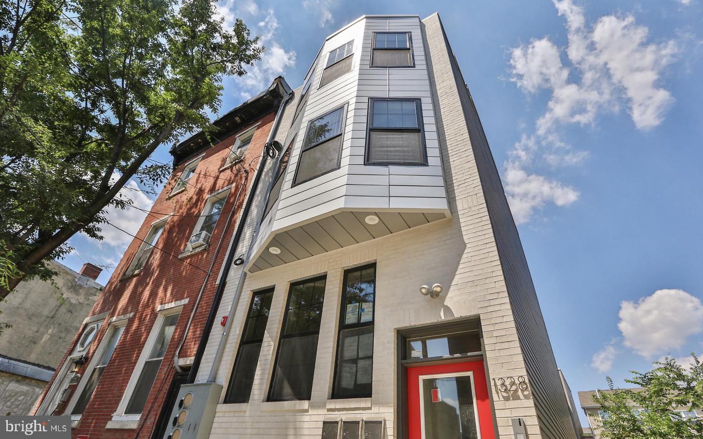 This newly constructed triplex at 1328 N 7th St offers the perfect opportunity for investors or owner-occupants looking to live in one unit while generating rental income from the other two. This property was built in 2018 with top-of-the-line finishes, including premium bamboo floors, high ceilings, and outdoor spaces for each unit. The property features three spacious units: Unit 1 is a 3-bedroom, 2.5-bath bi-level layout with two outdoor patios, currently rented for $1,990 with room for increase. Unit 2 is a 2-bedroom, 2-bath unit with a large deck and is currently vacant, ready for immediate occupancy. Unit 3 is a 2-bedroom, 2-bath unit with a private roof deck offering stunning skyline views, currently rented for $1,869 with room for increase.
Located within walking distance to Northern Liberties and Fishtown, with easy access to I-95 and Broad St, this property is ideally situated in one of Philadelphia’s most rapidly developing neighborhoods. With 4 years remaining on the tax abatement and located in an Opportunity Zone, this triplex offers unmatched flexibility. Whether you choose to live in one unit and rent the others, hold it as a rental property, or convert even it to condos for resale, the potential is undeniable. Don’t miss your chance to secure a valuable asset in one of Philly’s hottest markets—schedule your tour today!