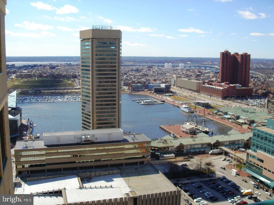 Sky Suite level with best views in the building!  Private balcony overlooking the inner harbor!  9' ceilings, split bedroom design for max privacy.  Stainless appliances, granite counters, wood floors, gas cooking and fireplace!  Full-service building with 24-hour desk, rooftop pool, internet business center, state-of-the-art gym, and club room.  PARKING INCLUDED in attached garage.  Additional parking available.  Enjoy the high-rise lifestyle from the top of one of the most popular inner harbor condos!  Water Sewer and Gas included in rent price.