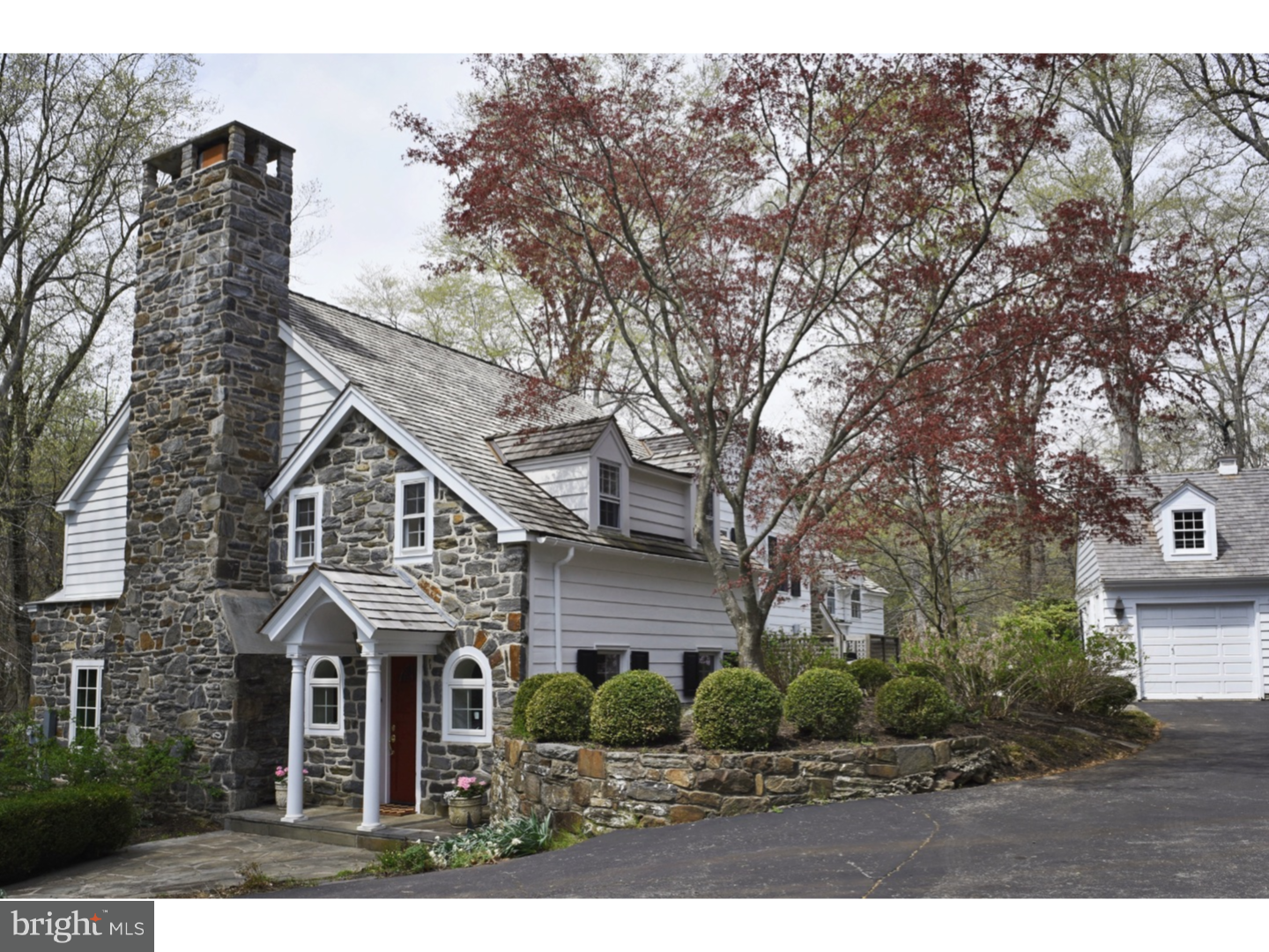 Located in the premier estate section of Newtown Square, this classic stone and clapboard offers a lovely mixture of charming architectural detail with modern stylish renovations. Fabulous new kitchen is the heart of the home! Enjoy large granite island, top-end appliances, farm sink, extra refrigerator drawers in the bar area. There are rich hardwood floors throughout, deep window sills and charming backstairs. Floor-to-ceiling French doors in the family room and lovely curved window in dining room bring the outside in with natural light and private views. The grounds are impressive! A sweet side patio with sitting wall and large back terrace overlook lush greenery and mature plantings. What a view! Large flat yard ringed by trees, two small ponds and stream begs family activities or perhaps a garden party. This property is a remarkable combination of generous living spaces, great neighborhood, quiet privacy and convenience - walk to Aronimink, minutes to EA and Paoli train. A rare gem!.