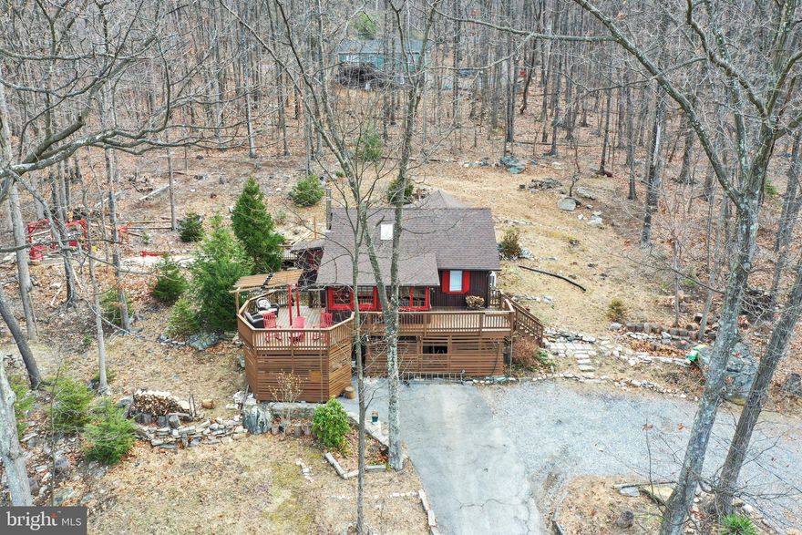 *NO HOA* This charming log chalet is located in beautiful Harpers Ferry and yet just over an hour from Washington DC! Offering a cozy and private atmosphere this home could easily be your weekend escape, full time residence, or income earning AirBnB! Surrounded by nature, you are within walking distance to the Appalachian trail, the Mountain Lake Club, and Shannondale Springs. Within a short driving distance to downtown Historic Harpers Ferry, the Shenandoah and Potomac Rivers, Adventure Center offering tubing, kayaking, zipline and more! Convenient to VA's wine trails and all commuter routes including Rt 7, US340, and the MARC Train stations. It’s truly an outdoor enthusiast’s dream! The home itself offers 2 Bedrooms, hardwood flooring, vaulted ceilings, cozy woodstove for chilly nights, a bright open layout, attached sunroom, and updated Kitchen with granite counter tops and stainless appliances. Enjoy the wooded views from the deck  or firepit locations! Property is being sold with adjoining vacant lot to bring the total to almost 1 acre!  *HIGH SPEED INTERNET AVAILABLE*