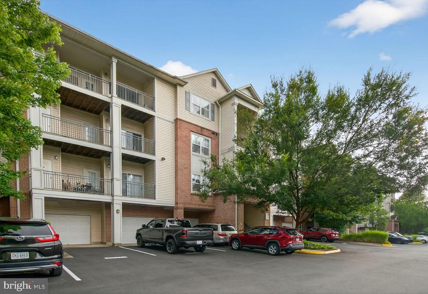 Take advantage of this great opportunity! Seller is offering a 2% credit toward an interest rate buydown or closing costs, making your new home more affordable.
Stunning, light-filled top-floor condo featuring 2 spacious bedrooms and 2 full bathrooms! Freshly painted throughout, this beautifully maintained home boasts an open-concept kitchen with stainless steel appliances, granite countertops, and ample cabinet space. Recent renovations include a new in-unit microwave, refrigerator, and master bathroom toilet.
The expansive living room with a cozy gas fireplace opens to a private balcony with peaceful wooded views, perfect for relaxing or entertaining. The versatile primary suite has been thoughtfully used as a home office and gym by the current owners and includes an attached bath with spa tub, a large walk-in closet, and a separate linen closet. The second bedroom also features its own generous walk-in closet. Stylish hardwood-look laminate flooring flows throughout the unit. Additional highlights include a dedicated in-suite laundry room with extra storage, a newer hot water heater, and a modern electronic keypad entry.
Enjoy one assigned parking space plus abundant visitor and street parking. Located in a secure gated community offering premium amenities like clubhouse, pool, and gym. Just a short stroll to Fairfax Corner’s shops, dining, and movie theater, and minutes from Fair Oaks Mall, Fair Lakes Promenade, and Wegmans!