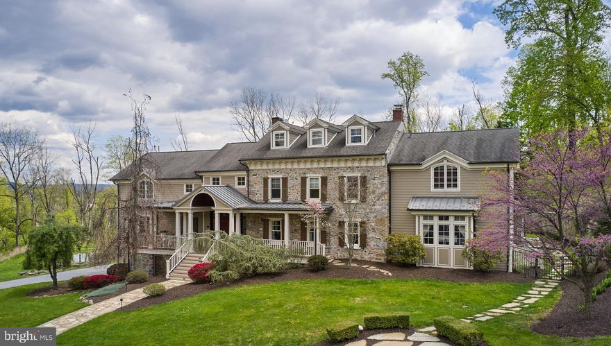 This premier property in Oley boosts over 6,500 square feet of living space, sits on 66.76 acres of partially wooded land and has an in-ground pool, fenced in pastures, large bank barn and a 3 car attached garage!  A long, private drive leads you to this stately 2.5 story home with 4 bedrooms, 4 full and 2 half baths.  The original home was built circa 1840 and then lovingly expanded and updated, with timely architectural details, with exposed stone walls and crown molding and millwork, and the modern conveniences of today. The circular drive leads you to the front entry via a stone walkway and has a full, covered front porch, atrium window and double front door entry. A large open foyer with beautiful staircases start your journey. Brazilian Cherry floors, throughout most of the home, guide you into the large formal living room with a beautiful coffered ceiling with recessed lighting and a wood burning fireplace. From there, you can enter the sitting room/office, which offers great views and privacy. The expansive, gourmet kitchen features upgraded granite countertops, backsplash, double wall ovens, induction cooktop with pot filler, double Subzero refrigerator (full fridge on one side and full freezer on the other) with pull out freezer drawers, and a huge center island with double sink and seating.  There is also a large breakfast area with great views of the mountains.The formal dining room sits right off the kitchen and overlooks the pool and rear yard. The family room is perfect for entertaining guests with cathedral ceilings, gas fireplace, French doors out to the rear patio, large remote controlled movie screen, speaker system as well as a custom wet/dry bar. The sunroom adds additional living space with French doors to the patio and gorgeous pergola and offers lots of natural light and warmth to the home. The second floor landing has luxurious built-in cabinetry, making it a great place to study or get some work done, while overlooking the stunning views. The primary ensuite features a cathedral ceiling with wood beams, a large walk-in closet with tons of storage a beautifully updated bath with a walk-in tile surround shower, double vanity and jetted tub and skylights.  There are two additional bedrooms on this level, with walk-in closets and each have their own private bathrooms. A convenient 2nd floor laundry center has countertop and tons of storage cabinetry. The third level of this magnificent home holds the 4th bedroom with its own updated, private bathroom with a stall shower and large vanity. The lower level offers a great space for a gym or playroom, a half bath/changing room for after outdoor activities, walk-out with a dutch door and more storage space then you may ever need. Your outdoor oasis begins with a built-in grilling station under the pergola with counter, sink and seating, a heated, salt-water in ground pool and hot tub, a private deck, a play area with one of the cutest “crooked” treehouses you have ever seen and 66 acres of rolling countryside.  Fenced pastures, as many horses as you can afford, walking/hiking trails, a chicken coop and a very large bank barn which can be used for hay storage, farm equipment or an additional garage. There is also a Spring fed pond, lovely gardens and 1600 feet of commercial road frontage, zoned highway business.  There are also 20 acres of tillable land.  This beautiful home and stunning property offers the next buyer many livable options.