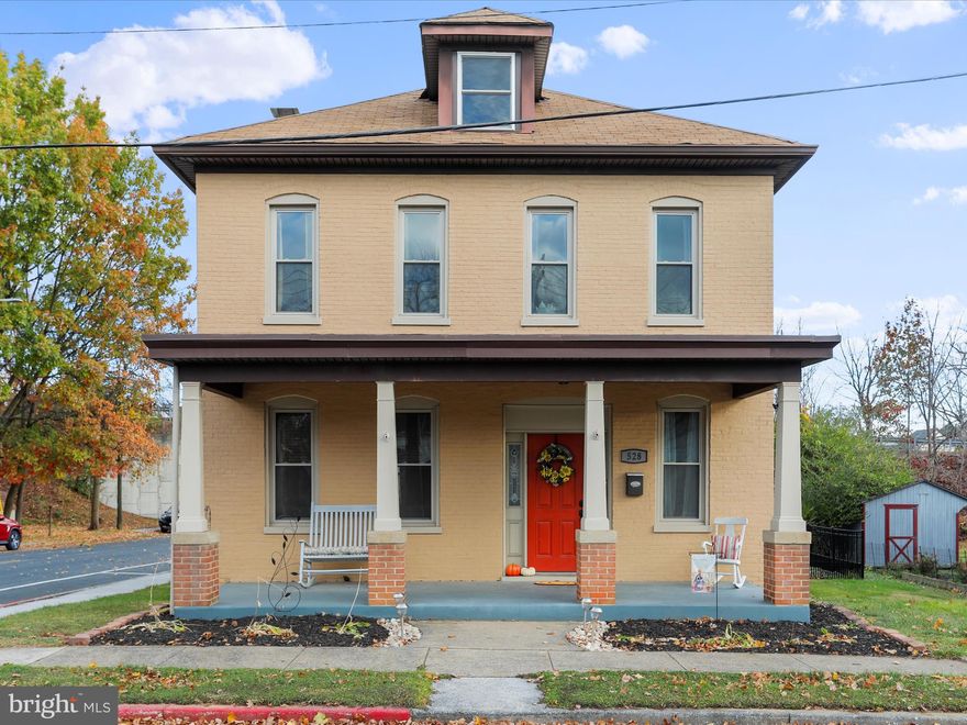 Where classic vintage charm meets beautiful modern updates. Welcome home to this almost 2,500 sq. ft., four bedroom/1 full bathroom/1 half bathroom, all brick colonial home on a corner lot with a fully fenced in back yard and detached, oversized two car garage tucked in on a quiet dead-end street. Gorgeous hardwood floors and stunning original woodwork throughout the home, working pocket door, high ceilings, and two-story back porch just add to the classic 1910 vintage charm. Completely updated kitchen with stainless steel appliances, upgraded countertops, and plenty of useable counter space. Laundry conveniently located on the main level. Washer and dryer included. Half bathroom just off the kitchen. Large separate dining room will easily accommodate holiday gatherings. Spacious four bedrooms on the second floor and updated full bathroom with tub/shower combination. Huge attic has easy walk-up stairs and solid wood floor that can be used as storage or play area. Full basement is very clean and can be used as plenty of storage space. All the windows were replaced 5 years ago. Central air conditioning and efficient gas heat round out the tasteful modern updates. This home is truly a must see. Located within just minutes to I-70 and I-81, the Premium Outlets, Meritus ballpark, and restaurants. Ideal commuter location with close proximity to the PA and WV state lines. Schedule your showing today and enjoy your holidays in your beautiful new home!