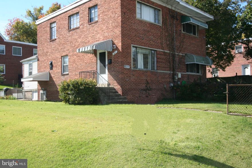 All Brick Semi-Detached House with 3 Bedrooms and 1 Full Bath.  Steps away from the Ride-On Bus and the Metro Bus.  Less than 1 mile to Takoma Langley Crossroads Transit Center! Super Living Room/Dining Room combination with hardwood flooring.  Outlet closest to door is connected to upstairs light switch so you can turn on a light before coming downstairs.  Kitchen has all stainless steel appliances including built-in microwave, gas stove, dishwasher and refrigerator.  Bonus Room is fully insulated and has exit to patio out back.  There is a pass-through from Bonus Room to the Kitchen.  Kitchen and Bonus Room have laminate wood flooring.  Beautiful! Upstairs all bedrooms have hardwood flooring.  There is a spacious linen closet.  One Full Bath with ceramic tile flooring. The full basement has plenty of light coming in through the windows.  In the full, finished basement there is a cedar closet, a regular closet, benches with under the seat storage and a dry bar.  The laundry room has your electric washer and dryer, a counter and cabinets as well as a 2nd refrigerator.  There is an exit out of the basement to your fully fenced yard! Storm Doors on Front and Basement Doors.  There is an awning over the front door and cover over basement door.  No pets.