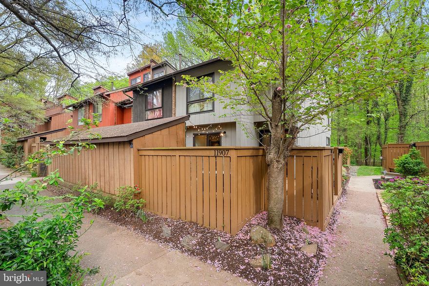 Welcome home to 11907 Escalante Ct in Reston—an updated end-unit townhome tucked into a quiet, tree-lined setting in the heart of the community. With two inviting outdoor spaces, including a private deck backing to trees, this home offers the perfect balance of indoor comfort and outdoor living.

Inside, you’ll find over 1,700 square feet with three bedrooms, two full baths, and a half bath, plus a spacious upper-level loft ideal for a home office, rec room, or flex space. The home blends classic Reston charm with thoughtful modern updates throughout.

The owner has taken great pride in maintaining and upgrading the home over time. Recent improvements include new flooring, brand new appliances and countertops (2026), a new HVAC system (2023), updated lighting and ceiling fans, new interior doors, and a Pella front door. The fireplace has been beautifully refreshed, the bathrooms have been tastefully updated, and the exterior has been freshly painted—making this home truly move-in ready.

The setting is just as special as the home itself. Tucked toward the back of the community and surrounded by greenery, it offers a sense of privacy while still being close to everything. A nearby walking trail makes it easy to get outside and enjoy the natural surroundings.

Living in Reston means access to an incredible range of amenities, including pools, shopping, community centers, basketball and tennis courts, arts and events, a farmers market, and a wide variety of restaurants.

Additional features include a private, fenced front entrance, an assigned carport, and ample open parking for guests.