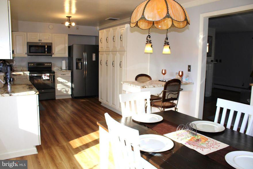 This stunning 4-bedroom, 3-bath home offers the perfect blend of comfort and modern living. Nestled on a nearly 1/2-acre lot, it features a 1-car garage, an open and spacious living room with a cozy fireplace, and a beautifully renovated kitchen complete with custom cabinets for ample storage, newer appliances, and a hand-beaten copper sink that adds a touch of elegance. Added to this home also is a all seasonal sun room for natural light with beautifully exposed  brick, ample windows making it perfect for entertaining or additional living space.
With a newer roof and double-pane energy-efficient windows, this home is as practical as it is beautiful. The finished basement boasts over 1,500 sq ft which includes a fireplace and with walkout access to the back yard and patio.
Conveniently located near major highways, commuting is a breeze. You'll also enjoy proximity to National Harbor, Virginia, and miles of monuments, museums, and trolley tours that make this area truly special.

This home is an absolute must-see—schedule your tour today!