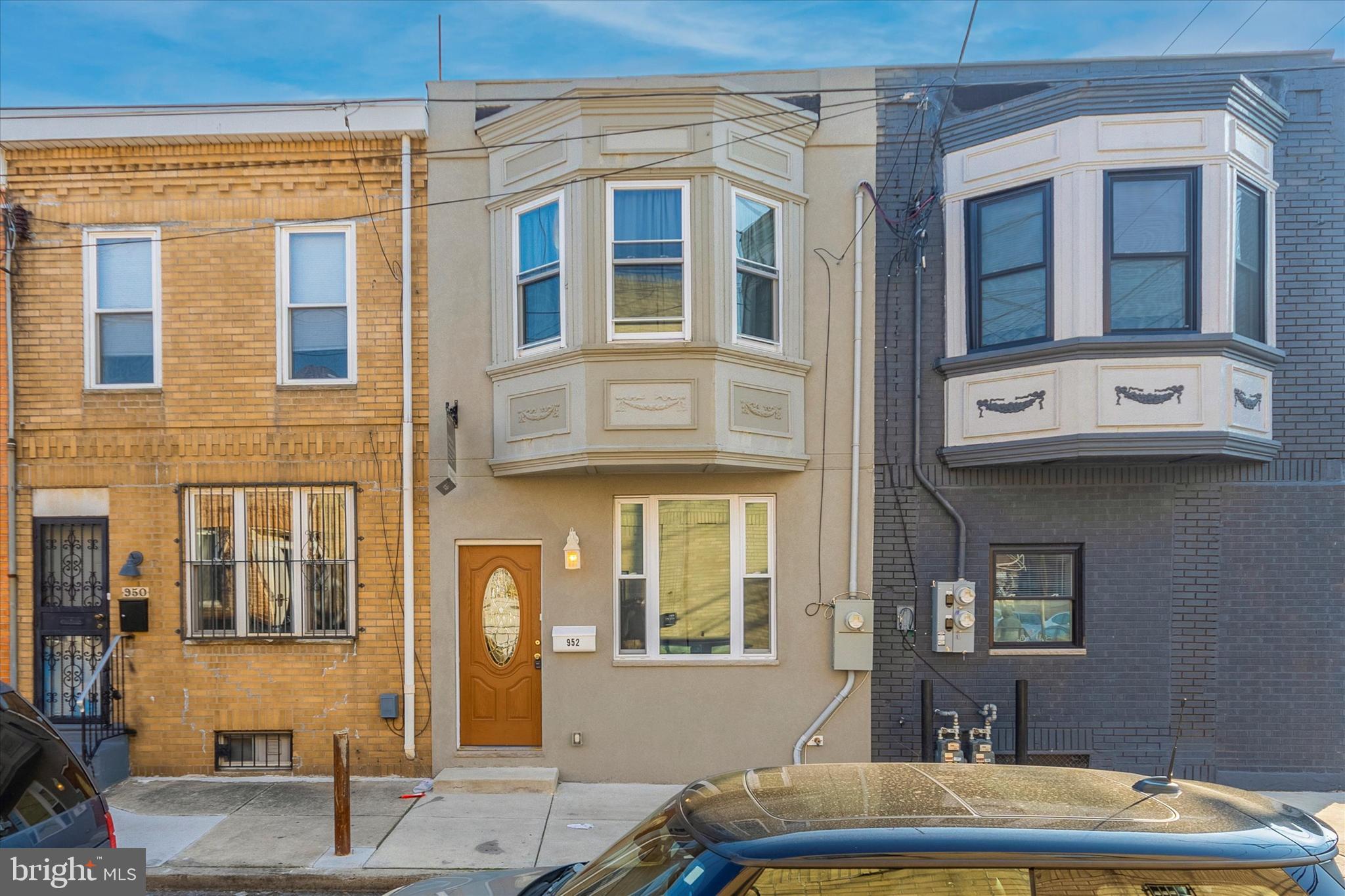 Welcome to this fully renovated spacious South Philly row home- just a couple of blocks from E Passyunk Avenue and the Broad Street subway line!  Enter into the large open floor plan first floor, with hardwood floors, iron railings, and recessed lights throughout.  There is plenty of room here for a large living room area and dining area with the kitchen at the rear. The kitchen features white Shaker style cabintry, granite countertops, and stainless steel appliances. Just past the kitchen peninsula you'll find a sunny breakfast area with sliding glass doors to the rear patio.  The the second floor is a very large owners suite with bay window and full bathroom.  You'll find two additional bedrooms and a second full bathroom with a tub on this floor.  The basement is fully finished with tile floor, half bathroom, and laundry area.  With all updated utilities this clean modern home would be a great addition to your portfolio or fantastic for an owner occupant.  This home was completely redone in 2017-2018, including the front wall, and has 5 years remaining on the tax abatement! Just steps from all of the shops and restaurants in East Passyunk, close to major highways, the Broad Street subway line into Center City, and the stadiums.