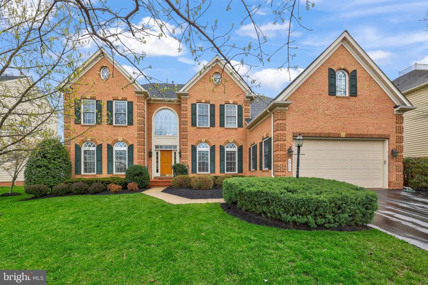 Offer deadline set: April 19th at 6 p.m. **Pristine and Stunning Brick Colonial Executive Home offering over 7,000 square feet of refined living space with 5 bedrooms and 4.5 bathrooms. A grand entryway and soaring two-story foyer set the tone for the elegance that follows. Gleaming hardwood floors flow throughout the main level, where you'll find a sophisticated sitting room, a beautifully appointed dining room, and a breathtaking two-story Great room with built-ins and fireplace that anchors the space with warmth and grandeur.
The gourmet chef’s kitchen is a true showstopper—offering expansive granite countertops, abundant cabinetry, stainless steel appliances, a walk-in pantry, and a sunny breakfast area framed by floor-to-ceiling windows. A main-level office provides a quiet retreat for work or study, and a large laundry room adds convenience to everyday living and leads to the spacious extended two car attached garage.
 
The Upper Level of this magnificent home features a luxurious primary suite designed to feel like a private haven, complete with a sitting area perfect for unwinding with a book or movie. The spa-like ensuite features dual vanities, a soaking tub, and a separate shower. Additional bedrooms are generously sized, with ample closet spaces and offering comfort and privacy for family and guests alike.
 
The expansive lower level is an entertainer’s dream, complete with a custom bar, a dedicated movie room, and an additional bedroom and full bath.  A walk-out staircase leads to the beautifully landscaped yard, where you’ll find hardscaping, a patio for outdoor dining, and a generously sized deck ideal for gatherings under the stars. The premium lot backs to common wooded spaces and the mature trees create a private oasis within the fully fenced rear yard.
 
Located in an amenity-rich community of Lansdowne that features a 30,000 square foot Community Center, multiple swimming pools, volleyball courts, tot lots,manicure open spaces, access to the Potomac River and Goose Creek, plus the award winning Lansdowne Resort.  
 
This home offers the perfect balance of luxury, comfort, and lifestyle. Just minutes from Route 7, One Loudoun, and nearby shopping, retail, award-winning restaurants, this is truly a spectacular home in a sought-after location. Showings by appointment only.
