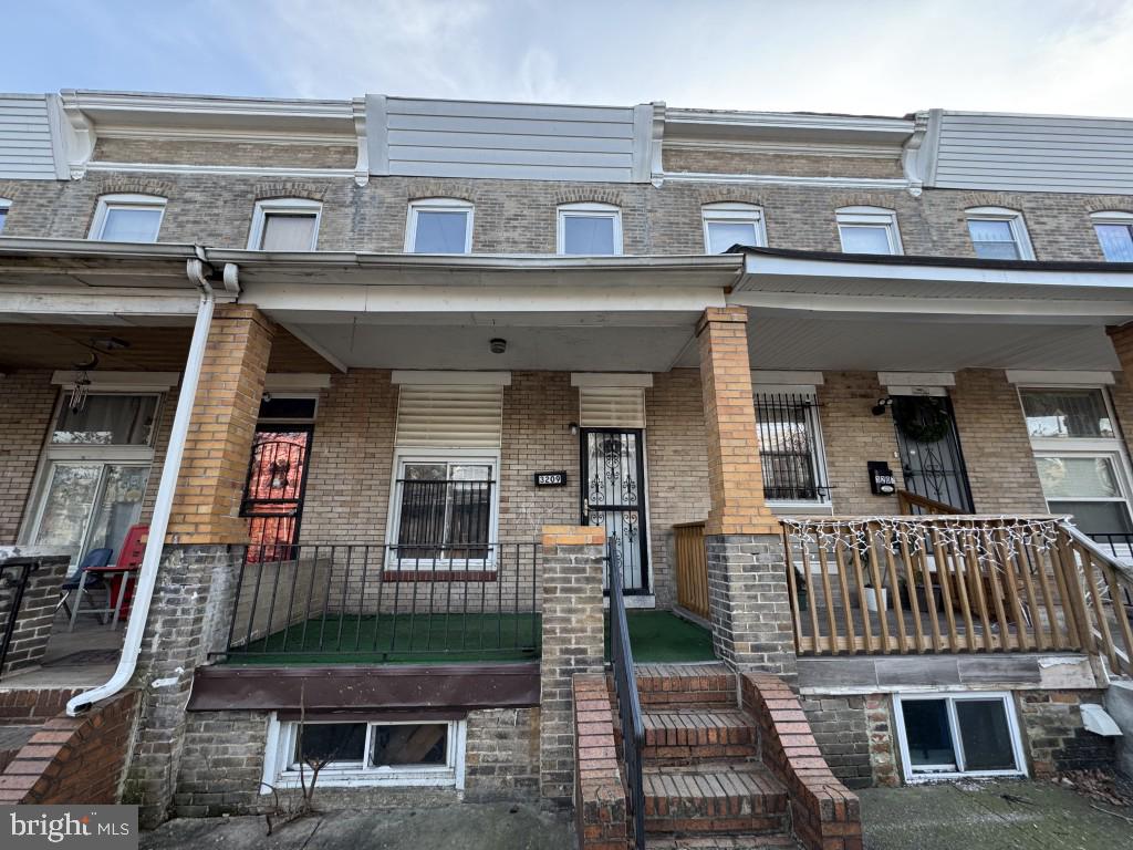 Spacious all brick townhome in convenient location. Open main level floor plan with hardwood flooring. The home features a huge covered front porch. Plenty of street parking and great access via the rear alley. Unfinished basement is ready for imagination.