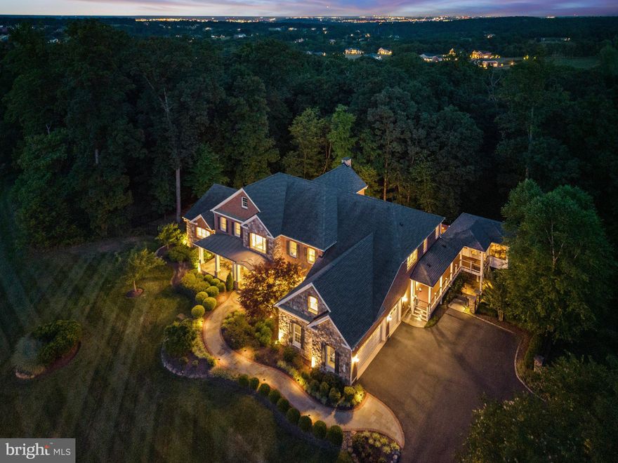 FIRST TIME ON MARKET!!!  Experience the pinnacle of LUXURY LIVING in this EXCEPTIONAL 9000+ square foot ESTATE HOME situated on 3 PRIVATE ACRES in the COVETED Shenstone Reserve Community just minutes from downtown Leesburg!  This 6BR/9 Bath PROPERTY is LOADED w/ over $600K in BUILDER UPGRADES and $300K in Hardscape, Decking, Patios and a GORGEOUS 3-Seasons Room.  MULTI-GENERATIONAL Living at its FINEST w/ 2 SPACIOUS PRIMARY SUITES including a COVETED Main Level Suite with Private Veranda .  STRUCTURALLY this PROPERTY has 9FT+ Ceilings on all three levels.  The MAGNIFICENT and GRAND Foyer includes a DISTINCTIVE Double Curved Staircase with SOARING Ceilings, Marble Floors and UPDATED Chandelier w/ lift system for cleaning.  EMBASSY Sized Formal Dining Room w/ STONE accent wall and coffered ceiling serves as the perfect venue for FAMILY Gatherings.   A DIVINE formal living room w/ wide-plank hardwood floors and beamed ceiling is absolutely EXQUISITE.  Main Level Study w/ mounted TV (conveys).   The 2-STORY Great Room FEATURES a BEAMED Ceiling, STUNNING floor-to-ceiling STONE FIREPLACE w/ SURROUND Sound and Mounted TV (Coveys).  The GOURMET Light-Filled Eat-In Kitchen is UNMATCHED!  Commercial Grade SS JennAir Appliances include Built-in Refrigerator, Two Dishwashers, Gas Range w/ Double Ovens, Additional Double Wall Oven/Microwave Combo w/ Warming Drawer and Trash Compactor.  DIVINE Island w/ Bar Seating and STORAGE Galore in the UPGRADED Cherry Cabinetry.  Separate Food Prep Sink and Separate Wine/Beverage Station w/ Built-In’s and Beverage/Wine Fridge.  SPACIOUS Eat-In Area w/ Mounted TV (conveys).  Access the 3-Car Garage through the Main Level Arrival Room w/ Built-In Lockers and separate Laundry Suite.  The 3-Car Oversized Garage includes EV Charger and Gladiator Garage Storage System (Conveys).    This PROPERTY includes the FINEST in-Home Automation by Control4.  CONTROL EVERYTHING (Audio/Heating/Cooling/Lighting/Security Cameras/TV’s/Locks/Security System) through your phone, wall-panels or custom room remotes.  COMPLETE SMART HOME CONTROL! Access the Upper Level Living Quarters from the REAR STAIRCASE.  Upper Level Features 3 SPACIOUS en-suite Bedrooms with a 2ND PRIMARY Suite w/ Tray Ceiling and Luxurious SPA Bath w/ JACUZZI Tub, Dual Vanities, Dual Water Closets and Separate Shower w/ Dual Shower Heads. Two Walk-in Closets including THE MUST-SEE Clothing Boutique step-down Closet FEATURING Built-ins DESIGNED for the PRINCESS in your LIFE.  Upper Level Primary Suite includes a WET BAR w/ Beverage Fridge.  UNWIND in the WALK-OUT LOWER LEVEL featuring a DEDICATED HOME THEATRE (equipment/seating conveys), Wet Bar w/ CUSTOM Built-ins and Dishwasher, Poker Area, Recreation Space w/ Billiards Table (Conveys), 500+ Temp Controlled Wine Room, 6th Bedroom Suite, Hobby Room or 2nd Home Office, Gym w/ custom flooring (PRX Gym Equipment conveys) and Storage Room w/ A/V-Home Automation Racks.  Walk-Out to Stone Patio w/ Built-In Fire Pit.  Lower Level Gas Line for direct connect to grill.    Additional outdoor living features Maintenance Free deck reinforced for HOT TUB (previously installed).  Deck includes gas stub for direct hook-up for Grill.  RELAXING Screened Porch w/ POPULAR EZE Breeze Windows.  EXPANDED Driveway for EXTRA Parking.  Black Iron Fencing added in back yard to keep four-legged family contained.    PEACE-OF-MIND-Pre-Listing 6PT Inspection Completed prior to LISTING.  In-Home Generator w/ dedicated 500-gallon propane tank.   In Home Water Filtration System serviced and evaluated prior to listing.  See Complete Conveyance to see all the EXTRAS.  Less than 20 miles to Dulles International Airport, commuter routes are an important attraction to many in the area as is an abundance of shopping, restaurants and other nearby retail – Wegman’s (The Village Center shops), nearby Town of Middleburg and many local wineries! THIS HOME WILL NOT DISAPPOINT.  Don’t MISS OUT ON calling 17741 Running Colt Place HOME!