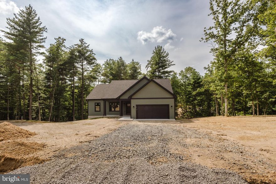 Are you looking for a private retreat in this brand new wooded subdivision?   Well look no further then this brand new subdivision  "Windfall Acres"!    This property features approximately 2800 finished sq ft and 2 lots totaling over 4 acres.   This 3 bedroom, 3 bathroom house is sure to knock your socks off.   Imagine sitting out on your front covered porch or on the back deck taking in the best that nature has to offer.  This home features 9 ft ceilings and trim work to knock your socks off.   The house is 95% complete only items remaining are a  4 piece Whirlpool Stainless Steel Kitchen appliance package to be installed, carpet installed in the basement, and driveway to be paved (asphalt).    This property consists of two lots.   Lots 22 and 23.