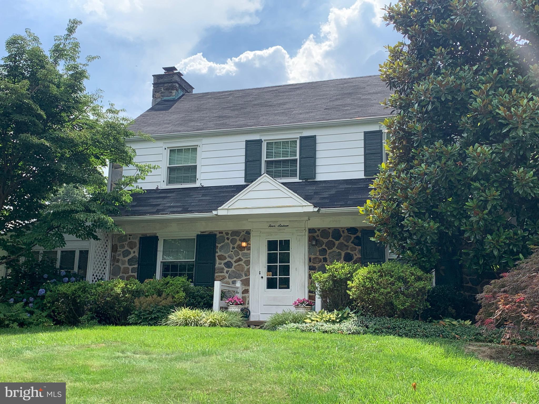 Lovely 2 story colonial located in the Shortridge section of Wynnewood.  A wonderful neighborhood in a location convenient to Parks, Shopping, Restaurants and Train. A private driveway is lined with Belgian Blocks leads to the front walkway.  Mature beautiful landscaping greets you as you walk to the front door.  The foyer has the stairway and coat closet, to the left is the spacious and sunny Living Room with a stone Fireplace, deep set windows, hardwood floors, crown molding and a large archway that opens into the Dining Room- from here you can access the very large rear deck via a sliding glass door and also the custom upgraded kitchen with lots of cabinets and counter-top area.  A Pantry, gas stove, microwave , tile floor and tile backsplash are only some of the amenities.  Off the living room is the warm, cozy sun room with windows all around.  There is a powder room and an exit to the rear driveway and yard.  Access to the garage and basement are just off the foyer. The second floor has a large Primary Bedroom with good closet space and a remodeled Primary Bathroom with a stall shower.  There are two additional bedrooms and an updated ceramic tile hall bathroom with a tub/shower.  The Basement is full and unfinished with laundry area.
This home is drenched in sunlight by the many windows, it has many charming features including warm hardwood floors that flow through most rooms, crown molding, and many deep set windows. Located within minutes to the local shops and train as well as a short distance to Center City Philadelphia and the Philadelphia International Airport.