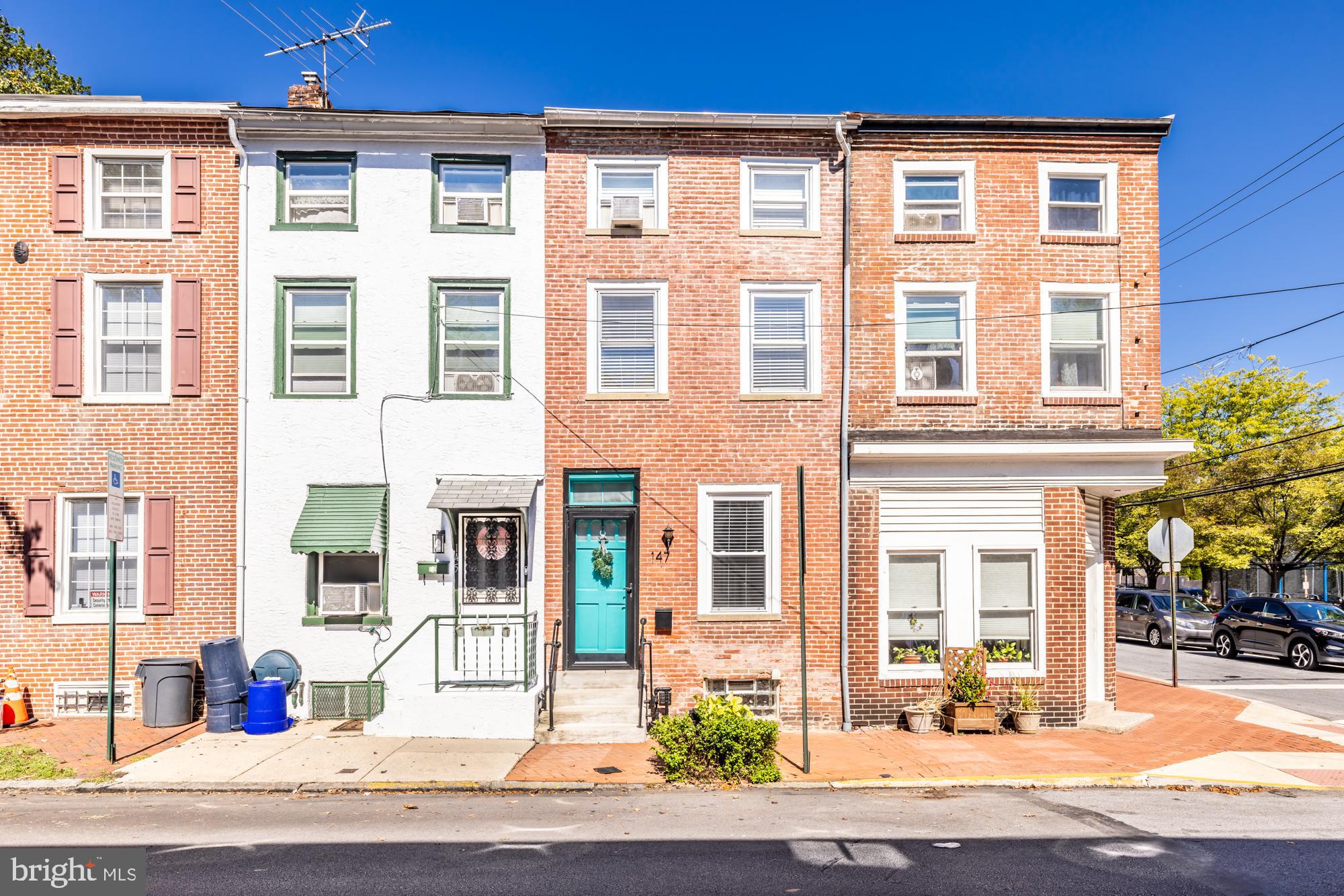 The true definition of a Townhouse. This gem is one block away from all that is West Chester downtown. As a bonus, the house has been carefully updated and upgraded. It is comprised of three bedrooms and one full (huge) bath and a convenient powder room. Entering the home, notice the beautifully refinished hardwoods in the living room and continuing through to the dining room. The kitchen is finished with ceramic tile floors, granite counters, stainless appliances and a beautiful brick backsplash. Also take note of the under counter lighting. There is an exit to the rear yard and private powder room located here. Take a tour of the outdoor space and you'll be amazed. It has been repurposed as a very private courtyard/entertainment area. When you relax out here, it's hard to believe you are so close to the hustle and bustle a block away. The second floor  boasts a bedroom (presently used as an office) and large bathroom with linen closet and laundry. This bathroom was updated in 2019 and it shows. Continuing to the third floor and you will find two additional and quite spacious bedrooms with ample closet space in both. The basement is unfinished, and clean as can be, with lots of room for storage.