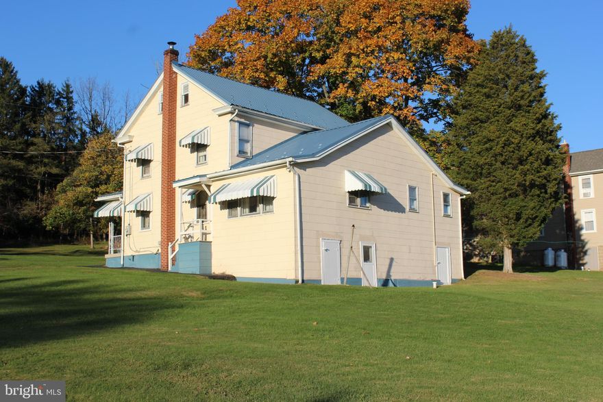 HIGHEST and BEST please by Friday November 3, 2023 at 5:00 p.m.
4 bedroom, 2 bath home on a large lot with panoramic mountain views!  Enjoy outdoor family time on the large mostly flat lot this home features.  Plenty of off- street parking with room for future outdoor amenities if you wish.   Enter into the flexible space which could be used as a double living room or living room dining room combination.  Next into the large bright eat in kitchen which has three large windows with natural lighting. Two first floor full bathrooms, additional kitchen and living room space also on the first floor. 2nd floor has 4 bedrooms and closet storage.  Third floor attic for additional storage.  So many possibilities with this home, in law quarters or optional single floor living.   Come see this home on a side street in Williamstown today and make it yours.  Seller is selling AS IS.