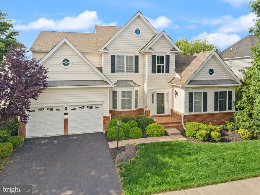 Situated on a premier lot within the prestigious, gated golf course community of Dominion Valley Country Club, an award-winning neighborhood with all of the resort amenities that you are looking for. This is the fabulous Princeton model with over 5,500 square feet of elegant space, the home features a main-level primary suite for unmatched comfort and privacy. The open floor plan is highlighted by custom finishes throughout. A handsome main-level office (or fourth bedroom) welcomes you at the entrance, while an elegant dining room boasts tray ceilings. The soaring two-story family room is filled with natural light and anchored by a stunning fireplace. The gourmet kitchen is a chef's dream, complete with a vaulted ceiling, spacious layout, high-end stainless steel appliances, and a large island perfect for meal prep, casual dining, and entertaining. A sun-drenched sunroom off the kitchen overlooks the beautiful backyard, which leads to an oversized custom deck. The main-level primary suite offers vaulted ceilings, his-and-her closets, and a spa-like bath. Upstairs, you’ll find two large secondary bedrooms and a full bath. The fully finished lower level includes a huge rec room, game room, tremendous storage, plus two large bedrooms—each with its own fully renovated bathroom. New carpet on the main level, new paint throughout the house and a full HVAC replacement in 2020. Come experience the Dominion Valley lifestyle! clubhouse, golf course, tennis and pickleball courts, and the resort-style pool. Enjoy a round of golf, work out in the fitness center, or meet friends for dinner in the beautifully remodeled clubhouse. The community offers walking trails, playgrounds, indoor and outdoor pools, fishing ponds, and basketball courts—there's truly something for everyone in the family. Shopping, dining, and top-rated schools are all right within the community.