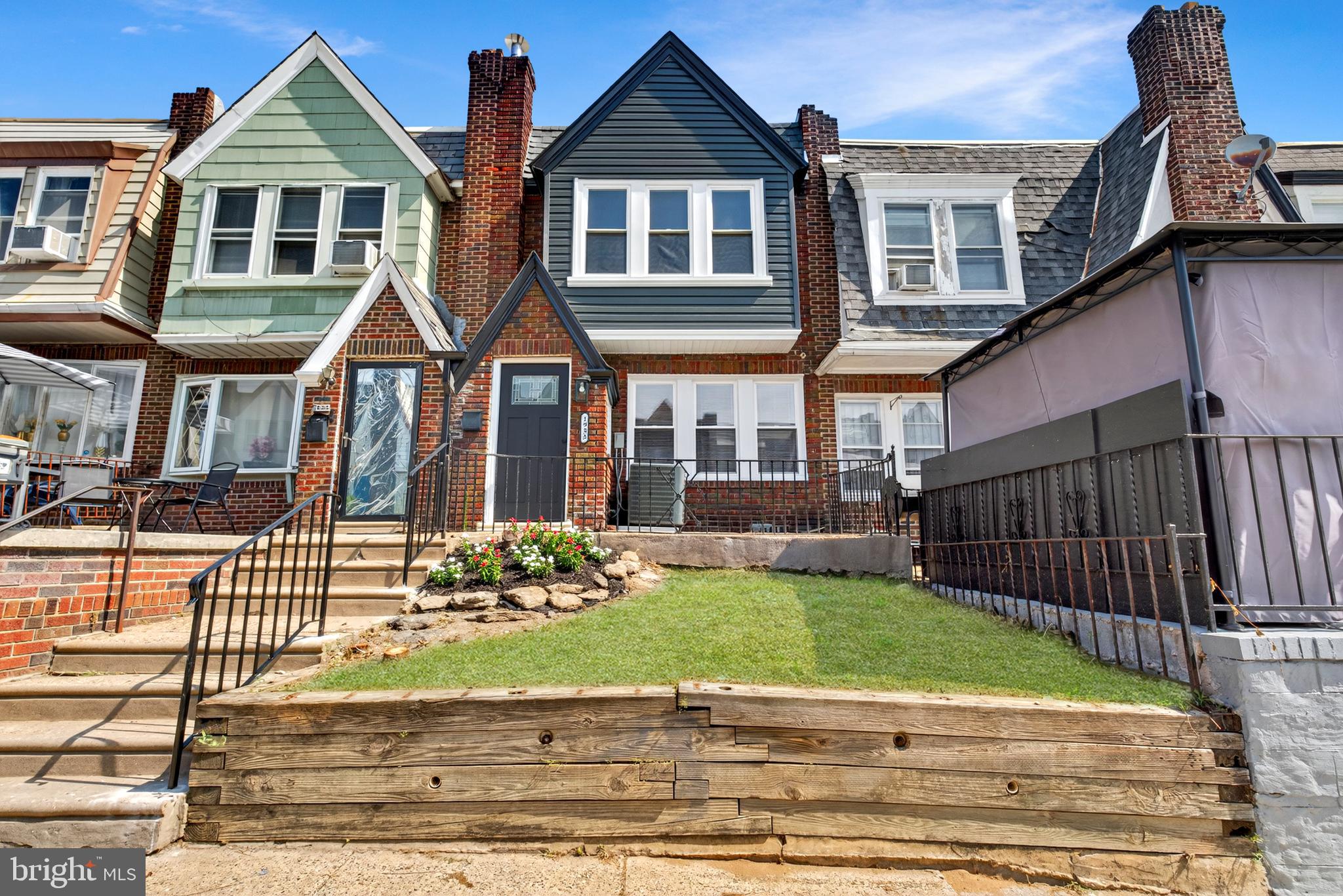 Welcome to 1933 Penfield Street, a stunning brand new rehabilitation in one of Philadelphia's most desirable neighborhoods. This beautifully appointed row home sits on an excellent, well-maintained block and showcases meticulous attention to detail throughout every square foot. Step inside to discover gorgeous hardwood floors with intricate inlay design work that flow seamlessly through the wide open floor plan. The gourmet kitchen features elegant marble countertops, premium stainless steel appliances including refrigerator, dishwasher, oven, microwave and wine fridge, plus a convenient countertop island with seating perfect for casual dining. Recessed lighting illuminates the space while modern lighting features and a striking built-in electric fireplace create an inviting focal point in the living area. The finished basement offers additional living space and includes a convenient half bath. Upstairs, the master bedroom boasts a gorgeous design wall and private full bathroom with stall shower. Two additional well-styled bedrooms share a full hall bathroom with tub. Modern light fixtures and ceiling fans enhance every room while central air conditioning ensures year-round comfort. The charming entryway welcomes you with a small garden area, and the property includes a lovely yard and patio for outdoor enjoyment. Convenient alley access provides typical parking for one vehicle. This exceptional home combines contemporary luxury with thoughtful design in a prime location where quality and community converge.