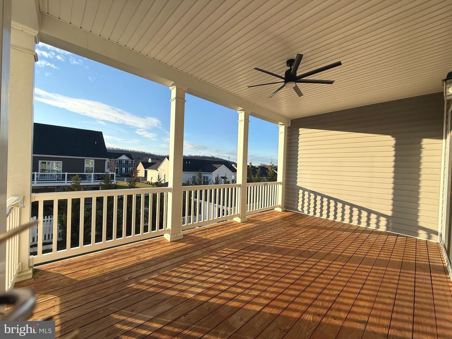 Welcome to this beautifully maintained home in the highly desirable Red Hill community in Martinsburg. This spacious property features a modern open-concept layout with a bright living area, high ceilings, and elegant crown molding throughout.
The upgraded gourmet kitchen offers ample cabinetry, quartz countertops and backsplash, and stainless steel appliances. Luxury hardwood flooring flows throughout the main level, adding warmth and sophistication.
Enjoy outdoor living on the large covered back deck, along with upgraded window blinds and  screen curtain control for added comfort and convenience.
The home offers generously sized bedrooms, including a relaxing primary suite with a private luxury bath and walk-in closet.
The fully finished walk-out basement with high ceilings includes a spacious in-law suite with a primary bedroom, an additional fifth bedroom, a second kitchen, and private access to a fenced porch—ideal for multi-generational living or potential rental income. Perfect for living upstairs while utilizing the lower level as an income-producing space.
Situated on a premium corner lot, this property provides added privacy and curb appeal, along with a storage shed in the backyard. Conveniently located near shopping, dining, schools, and major commuter routes with easy access to I-81.
Low HOA, well-maintained community in a growing area. Don’t miss this incredible opportunity—schedule your showing today!