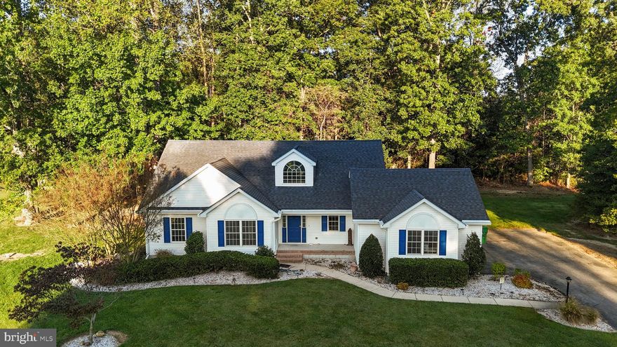 Welcome to this 4-bedroom, 3-bathroom home, on a corner lot, in an established neighborhood with protected wooded buffers. This property has a screened in patio and a connected deck on the back of the house that has a view of the woods and offers privacy for family activities. Inside, the spacious open floor plan offers many options for living room, family room, and dining set ups. The open living room has a cozy gas fireplace, creating the perfect spot to unwind and spend time with family and friends. The primary suite, located on the ground floor, has easy access from the garage and easy access to the utility room. Three additional bedrooms provide space for family, guests, or office space, and have an additional full bathroom downstairs and another full bathroom upstairs. Upstairs, the open balcony area could be used for a gaming room, an office, or an upstairs entertainment room.  Enjoy outdoor living at its best with a screened porch overlooking a backyard that backs to woods for added privacy, plus a deck that’s ideal for summer cookouts.  Privacy living but with necessary amenities not far away. Minutes away from Harrington, Milford, fishing, beaches, and RT1. Don't miss out on this one,  schedule your showing today!