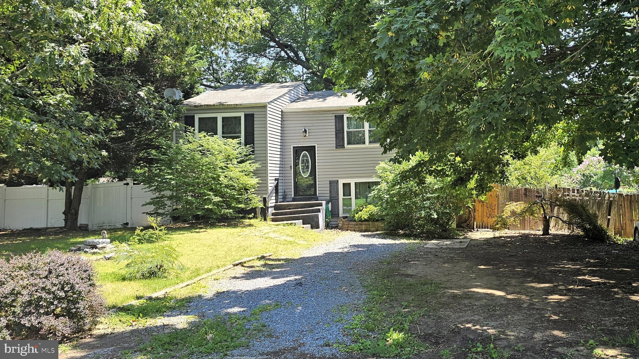 **100% FINANCING AVAILABLE** Investor and Service Member Alert & First-Time Buyer Dream – Fixer-Upper Potential Near the Water!** **No HOA | Steps from the Potomac River**
Get ready to unlock serious potential in this 4-bedroom, 2-bath split foyer home tucked away in the peaceful Cliffton on the Potomac community. With NO HOA, this property is perfect for buyers looking to break into homeownership without the typical restrictions.
Whether you’re an investor looking for your next project or a first-time homebuyer ready to roll up your sleeves, this property offers the perfect blank canvas. The flexible layout features 2 bedrooms and 1 full bath on each level, ideal for multi-generational living, a home office setup, or even house hacking!
Downstairs, the bonus flex room opens through charming French doors into a spacious, fully fenced backyard, ready for summer BBQs, fire pits, or even that dream pool. Bonus features include a gazebo and goldfish pond, both of which convey and add a touch of peaceful charm to your outdoor space.
Plus, enjoy peace of mind knowing the HVAC, roof, water heater, windows, and front door have all been updated within the last 3–7 years, giving you a solid foundation to build upon.
**Ideal for Commuters & Military Service Members!**
Convenient access to Route 301 means you’re just a short drive to Dahlgren Naval Base, Indian Head Naval Base, Joint Base Andrews, and NAS Patuxent River. You're also 10 minutes to King George, VA via the Harry Nice Bridge and only 15 minutes from downtown LaPlata for all your shopping, dining, and daily needs.
Whether you're looking for your first home or your next investment, this is one opportunity you don’t want to miss. SOLD STRICTLY AS-IS! Bring your vision and make it yours! Schedule your tour today before it's gone!