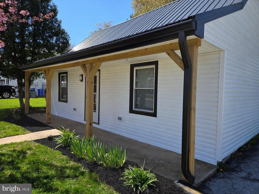 Welcome to 214 N Liverpool St. in Manchester, PA.  Who says affordable housing doesn't exist??
This three bedroom home sits on a generous corner lot, offering both a large yard and a private covered patio.  The first floor boasts a living room with exposed beams and a high ceiling, as well as a full bathroom, laundry, a bedroom, and a dining room that is open to the living room.  Up the open stairs to the second floor, you'll find two more bedrooms.  What's more, this home has had recent extensive upgrades that include new carpet, new LVP flooring, new vinyl siding, and a new metal roof, and new windows for lasting peace of mind!!!  If you've been waiting for an exceptional value, be sure to not miss this one!  Call to schedule your tour, today!