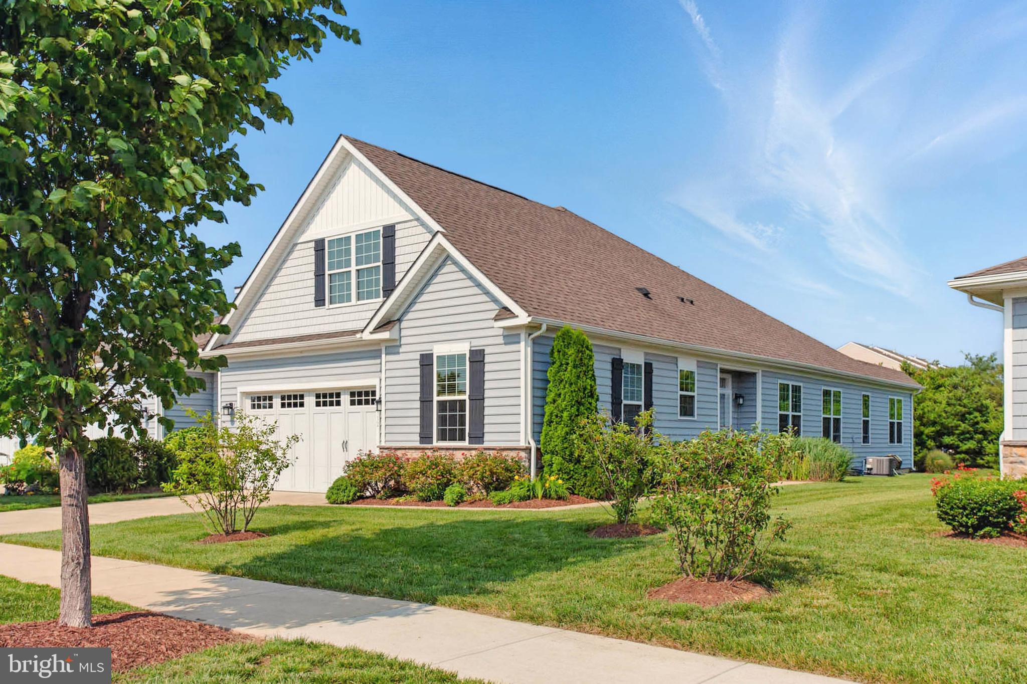 OPEN HOUSE! STOP BY FOR CHEESE & CRACKERS AND VISIT 5 HOMES IN BEAUTIFUL BAY BRIDGE COVE! TUESDAY, JULY 22, 4:00-7:00! Welcome to Bay Bridge Cove, a sought-after, premier,55+ community on beautiful Kent Island! This home is on a premier private lot, backing to trees, and perfectly located across from the community center where you can enjoy all of the wonderful amenities, stroll the walking paths, and enjoy the wildlife around the three community ponds. This popular Laurel model is filled with natural light and features an expanded floor plan with over 200 added square feet of living space - you will love the spacious great room with a fireplace, the upgraded island kitchen and flexible dining area, and the large rear bump-out. The primary bedroom is also expanded with an office or sitting room facing the landscaped patio and trees. A second full bedroom/office with access to a second full bath, and a laundry room complete the floor plan for comfortable main-level living. Enjoy the amenities of this wonderful community, including a gorgeous outdoor pool, tennis courts, a dog park, walking paths, crab shack, herb and vegetable gardes, and a clubhouse that features a meeting room with a full kitchen, a party room with a bar and billiards table, a library, and an exercise room. Bay Bridge Cove is conveniently located minutes from Shopping, golf, and waterfront restaurants and within walking distance of The Kent Manor Inn and Beach Club. It is less than five minutes to the Chesapeake Bay Bridge, offering easy access to Annapolis, BWI, DC, and Baltimore. A perfect place to call home!