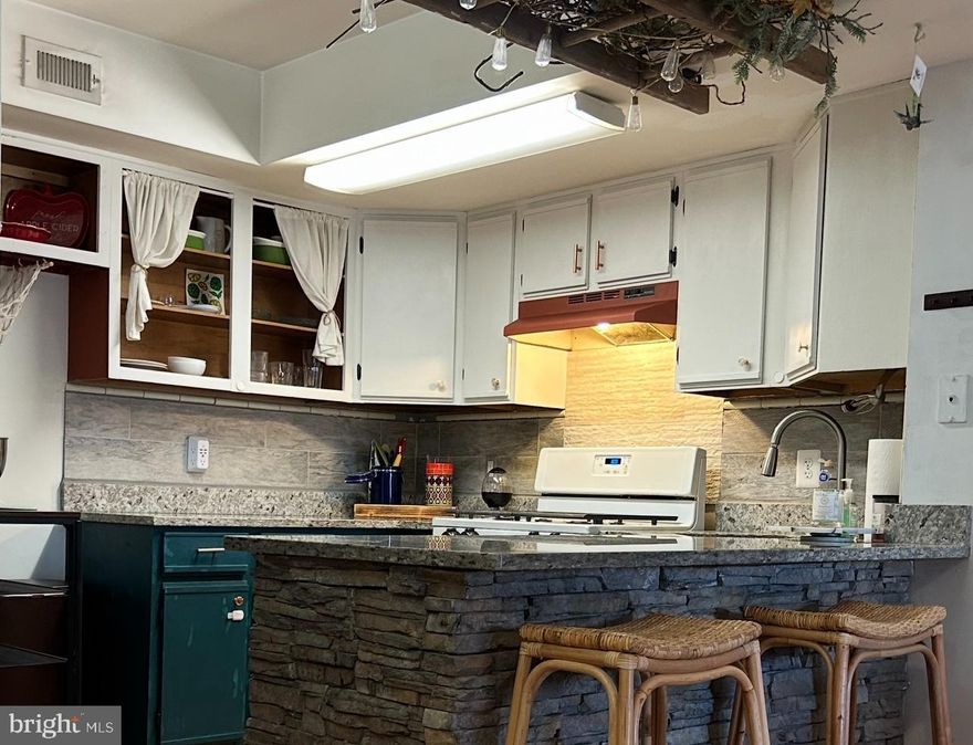 Set in the sought-after Saratoga Springs community, this 2-bedroom, 2-bath condo with two balconies and a loft brings together generous square footage, great natural light, and over $25K in recent system and lifestyle upgrades—all within steps of Historic Old Town Manassas.

At just over 1,100 square feet, the layout is open and easy to live in. The corner gas fireplace adds character, while the loft offers the “New York” feel buyers love—ideal for a media space, home office, gym, or creative studio. Two newly installed skylights (2024) flood the space with light, and fresh LVP flooring ties it all together.

The primary suite is surprisingly spacious, with 2024 LVP floors, fresh paint, and a flexible sitting area that can easily function as a small office, nursery, or oversized walk-in closet. The ensuite bath features a concrete shower and sink plus a new toilet (2024). The second bedroom includes a brand-new window (2024), and the second full bath is conveniently located for guests.

This home has been well loved and is ready for its next chapter. Major improvements already completed include:
• New HVAC + ductwork (2025)
• Two new skylights (2024)
• New sliding glass door (2024)
• New LVP flooring in primary suite + loft (2024)
• New carpet + metal balusters on stairs
• Electrical outlet + wiring upgrades (2022)
• New gas regulator, smoke + CO detectors (2023)
• New washer, dryer & refrigerator (2023)
• New outdoor stairs
• Granite counters, Italian tile backsplash, and stone accents around the kitchen island and fireplace

Two balconies offer room to unwind—front-row seats to Northern Virginia’s top-rated July 4th fireworks included. The condo also comes with two reserved parking spaces, outdoor storage, and an HOA that covers water and trash. The association has future plans to update roofs and balconies, adding long-term value.

Location is the standout: walkable to Old Town’s restaurants, coffee shops, farmers markets, and year-round events. The VRE station is a short stroll away, and nearby schools and playgrounds make day-to-day living simple.

If you’re looking for a smart investment with solid updates already in place—and room to put your own stamp on the finishes—this Saratoga Springs condo delivers comfort, convenience, and an unbeatable lifestyle in the heart of Manassas.