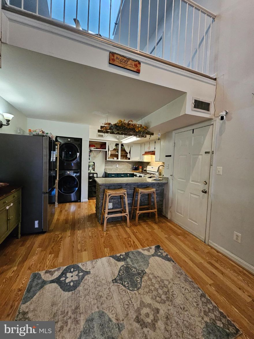 Set in the sought-after Saratoga Springs community, this 2-bedroom, 2-bath condo with two balconies and a loft brings together generous square footage, great natural light, and over $25K in recent system and lifestyle upgrades—all within steps of Historic Old Town Manassas.

At just over 1,100 square feet, the layout is open and easy to live in. The corner gas fireplace adds character, while the loft offers the “New York” feel buyers love—ideal for a media space, home office, gym, or creative studio. Two newly installed skylights (2024) flood the space with light, and fresh LVP flooring ties it all together.

The primary suite is surprisingly spacious, with 2024 LVP floors, fresh paint, and a flexible sitting area that can easily function as a small office, nursery, or oversized walk-in closet. The ensuite bath features a concrete shower and sink plus a new toilet (2024). The second bedroom includes a brand-new window (2024), and the second full bath is conveniently located for guests.

This home has been well loved and is ready for its next chapter. Major improvements already completed include:
• New HVAC + ductwork (2025)
• Two new skylights (2024)
• New sliding glass door (2024)
• New LVP flooring in primary suite + loft (2024)
• New carpet + metal balusters on stairs
• Electrical outlet + wiring upgrades (2022)
• New gas regulator, smoke + CO detectors (2023)
• New washer, dryer & refrigerator (2023)
• New outdoor stairs
• Granite counters, Italian tile backsplash, and stone accents around the kitchen island and fireplace

Two balconies offer room to unwind—front-row seats to Northern Virginia’s top-rated July 4th fireworks included. The condo also comes with two reserved parking spaces, outdoor storage, and an HOA that covers water and trash. The association has future plans to update roofs and balconies, adding long-term value.

Location is the standout: walkable to Old Town’s restaurants, coffee shops, farmers markets, and year-round events. The VRE station is a short stroll away, and nearby schools and playgrounds make day-to-day living simple.

If you’re looking for a smart investment with solid updates already in place—and room to put your own stamp on the finishes—this Saratoga Springs condo delivers comfort, convenience, and an unbeatable lifestyle in the heart of Manassas.