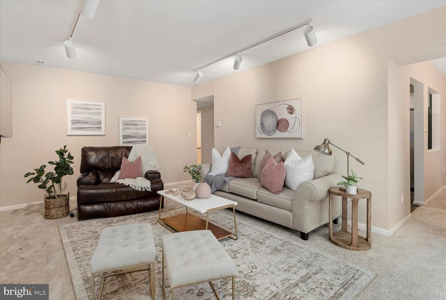 Welcome home to this stunning mid-level unit in the highly sought-after Mays Chapel area. This 2 bedroom/2 bathroom condominium offers a perfect blend of comfort and style. Step inside to discover the new carpet and LVP flooring in kitchen that adds a fresh and modern touch to the space. The front-facing bedrooms are a true delight. The primary bedroom is generously sized and features a walk-in closet and a custom bath with a double vanity and a walk-in shower.  The hall bath is equally impressive with its oversized with tile.  It provides both style and functionality for your everyday needs. Prepare to be impressed by the crisp white kitchen, complete with granite countertops and a suite of stainless-steel appliances. These sleek additions give the kitchen a contemporary and sophisticated look while ensuring a seamless cooking experience. From the living room/dining room area, step out onto the rear-facing balcony and indulge in the tranquil view of the lush green common area with its mature trees. Take a moment to observe the resident birds, squirrels, foxes, and deer in this serene setting. Convenience is paramount in this location, with quick access to shopping and dining in Mays Chapel. The zippy access to I83/695 makes commuting a breeze, connecting you to various destinations with ease. Blue Ribbon Schools! Don't miss the opportunity to own this beautiful mid-level unit in the sought-after Mays Chapel area. Schedule a showing today to experience the perfect combination of comfort, style, and convenience it offers.