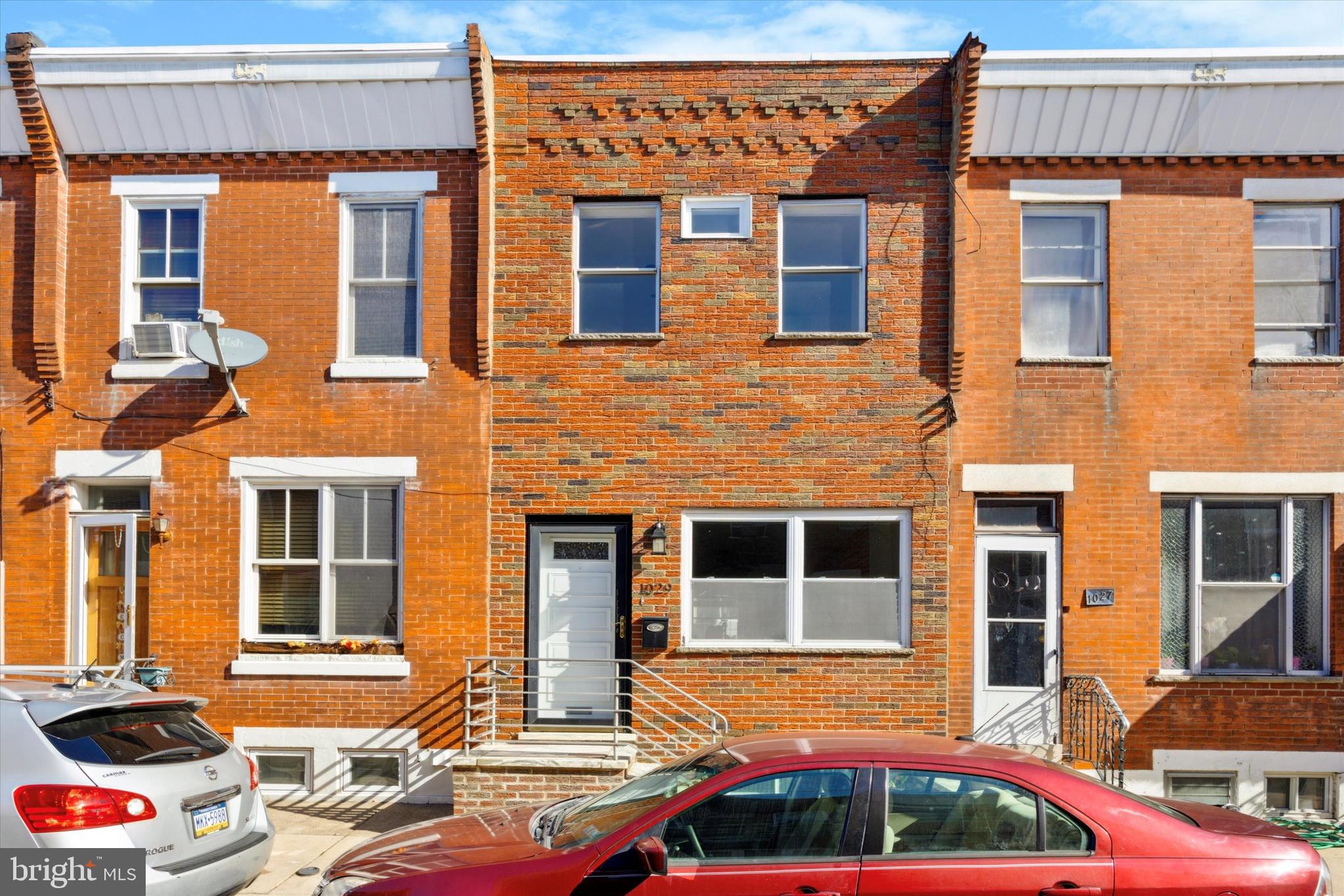 REDUCED! Welcome to 1029 Tree St, a stylish 2 bedroom 1.5 bath brick front home in the desirable Lower Moyamensing neighborhood of South Philly! Enter into the bright and cheery open concept living room/dining room combination which features a gorgeous exposed brick wall, original hardwood flooring, recessed lighting, and crown molding. An arched entryway leads you into the spacious eat in kitchen with retro tile flooring in excellent condition, granite counters, recessed lighting, and newer stainless appliances. The back patio has new fencing and is the perfect space for dining al fresco, gardening, working from home, an evening glass of wine, or morning coffee! A beautiful wooden staircase with vintage metal railing leads you to the second floor where you'll find two nice sized bedrooms with great closet space, ceiling fans, more beautiful hardwood floors, and a spacious bathroom with more vintage tile and bath tub. The full basement is partially finished, has great ceiling height, and includes a newly renovated half bathroom with sliding barn door. The back of the basement is great for storage and also includes a washer and dryer. Don't miss the retro tile feature and marble window sills on the front windows of the house, such a unique decorative feature! With new mini split central air and heat installed in 2020 as well as baseboard heat, this home will keep you comfortable all year long. The seller had all of the old knob and tube electric that you usually find in SPhilly homes removed and updated in 2020. In addition, the seller also installed a new chimney liner, pex plumbing, hot and cold water lines, washing machine hook ups, shut off valves, and a french drain and sump pump in the basement. This home has the perfect combination of modern finishes and vintage character throughout. Located just a block south of Snyder Ave, you're steps away from all of the fun and shopping on East Passyunk Ave but can also enjoy the new restaurants, coffee shops, and bakeries scattered throughout your own neighborhood. The location can't be beat! Check out this home today, you will not be disappointed!