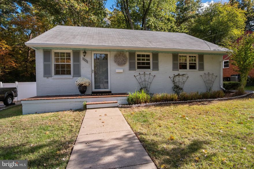 Great for first-time home buyer on giant, private 9400 plus sq ft lot, backing to County trees.  New wood floors upstairs and laminate in finished walk-out basement.  3 bedrooms on main level and one full bath.  Galley kitchen with breakfast nook and exit to backyard.  New paint and bead board throughout.  Finished walk-out basement features new laminate floors, one full bath, and a bonus room with door and closet. Newer (5-8 years) roof, furnace, hot water heater.  Windows convey "as is"