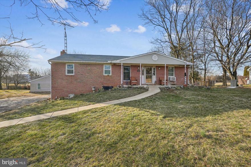 The Photo Don't Lie! You will love this Large four sided Brick Rancher with beautiful Mountain Views the moment you cross the threshold.  This wonderful Home features 3 bedrooms, 2 full baths on 3 acres. There is an Oversized, detached garage used as a workshop with 2 spare bedrooms and one bath. This workshop has a large overhang for a carport or equipment shelter. Approx 1.5 acres fenced. A Small barn is used currently for storage and equipment. Your new home has lots to offer inside & out. The Walkout Basement is finished with Rec Room, Laundry room and Den don’t miss the tons of additional storage. Many newer updates throughout- roof, water heater, laminated flooring. Septic updated in 2007. Playset convey with sale.