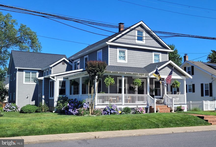 Just in time for Commissioning Week — walk to Navy-Marine Corps Memorial Stadium from this beautifully renovated Annapolis home that perfectly blends historic charm with modern convenience. Ideally located near downtown Annapolis and the stadium, this property offers incredible flexibility, abundant off-street parking, and a rare apartment/in-law suite above the 2-car garage.

Completely renovated in 2020, the main home underwent extensive upgrades throughout plus the addition of a stunning sitting room and 2-car garage with private apartment above. While thoughtfully modernized, the home still retains the timeless charm of historic Annapolis with preserved original details throughout.

The main level features an open, airy layout designed for everyday comfort and effortless entertaining. The generous living room flows into the dining area and showpiece kitchen, while the added sitting room offers a cozy retreat beside the gas fireplace. The kitchen impresses with quartz countertops, a massive center island, stainless steel appliances, pot filler, a stylish dry bar with wine fridge & bonus space for a home office. 

Upstairs, the primary suite offers three closets (including a walk‑in) and a beautifully appointed ensuite bath with double vanity and over-sized tile shower. Two additional bedrooms, a full bath, and conveniently located laundry complete this level.

The apartment above the garage is an exceptional bonus with endless possibilities — ideal for rental income, guests, multi-generational living, or private office space. Featuring its own entrance while still connected to the main home, this 1-bedroom, 1-bath suite includes vaulted ceilings in the living/kitchen area, a private balcony off the bedroom overlooking the serene backyard, walk-in closet, dedicated washer/dryer, and beautiful walk-in tile shower.

Storage is plentiful throughout the house with an added bonus of an unfinished basement and expansive floored attic.

Outside, enjoy an over-sized driveway with abundant off‑street parking plus an additional gravel pad perfect for a boat or RV. The wraparound porch, backyard, and garage create an ideal setting for crab feasts, entertaining, tailgating before Navy games, and savoring the best of Annapolis living. This home truly checks every box.