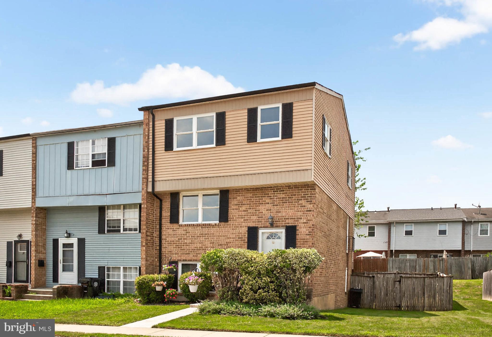 Spacious and stylish, this 4-bedroom end-unit townhome offers the perfect blend of comfort and functionality. The classic brick and siding exterior gives it great curb appeal. Inside, you'll find an open layout with brand-new flooring and fresh paint throughout. The main level features an updated kitchen with a breakfast area and a large family room, perfect for both relaxing and entertaining. Upstairs, there are four bedrooms and a full bath. The third and fourth bedrooms have been combined to create a large primary suite, but the wall can easily be restored to return it to a four-bedroom layout. The fully finished lower level includes a full bath and opens to a fenced-in backyard, offering plenty of space for outdoor enjoyment. Located just minutes from major highways, shopping centers, dining, and local parks, this home offers both convenience and comfort. A fantastic opportunity for anyone looking to move right in and enjoy everything the area has to offer.