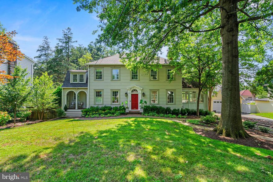 Classic Colonial Beauty on Huge Lot | 5 Beds | 3.5 Baths | 18,028 Sf Lot | Landscaped Yard | Detached Garage | Driveway Parking | Welcome to the timeless elegance of this home in Section 5 of the Village of Chevy Chase. Set back on an expansive lot, the property offers exceptional privacy and is surrounded by landscaped grounds.  Step into this home through a grand entrance hall featuring rich dark oak floors and an elegant staircase. A striking architectural window above the front door and oversized windows throughout the main level fill the space with phenomenal natural light.  The living room showcases custom built-ins and a wood-burning fireplace framed by a handsome wood mantel. French doors open to a flagstone patio with steps down to an additional brick patio — both perfect for outdoor entertaining. Adjacent to the living room is a charming sunroom or office, complete with large windows and additional built-ins.  The open kitchen has custom cabinetry, quartzite countertops, a peninsula with seating for two, an undermount sink, well-designed storage, and a walk-in pantry. A porch just off the kitchen adds to the home’s charm and functionality. Premium stainless steel appliances include a Thermador induction cooktop, Thermador oven, Bosch dishwasher, and a Liebherr refrigerator with bottom freezer.  Adjoining the kitchen is the formal dining room, beautifully appointed with a built-in china cabinet and custom Roman shades. A powder room is conveniently tucked away just off the foyer.

Upstairs, the spacious primary bedroom features an en-suite bathroom and a walk-in closet. This level also offers three additional bedrooms and a hall bathroom with a soaking tub.

The lower level includes a bright and inviting recreation room with floor-to-ceiling windows and French doors that open to the rear yard. A private fifth bedroom with its own entrance and cedar closet makes an ideal guest room or home office. A full hall bathroom with shower adds convenience.  Additionally, the expansive unfinished workroom offers ample storage, a place for exercise equipment, and a dedicated laundry area with a full-size washer and dryer.

This home features a driveway spacious enough to turn a car around, as well as a detached one-car garage.  The home has radiator heat that is complete with custom radiator covers.  The dual zone A/C system provides maximum temperature comfort.  Most of the windows were replaced in 2021, and many have custom interior wood shutters.

Section 5 municipality offers multiple amenities including a July 4th parade & party, a Halloween party, snow shoveling on sidewalks, an Arborist, weekly leaf collection in Fall, and composting.  It’s also within the boundaries for CCRA swim & tennis facility.  With very easy access to local parks, Chevy Chase library, Saturday farmer’s market, and the shops on Brookville Road, including the grocery, pharmacy, barber shop, café, and La Ferme Restaurant, a local favorite offering fine French cuisine.