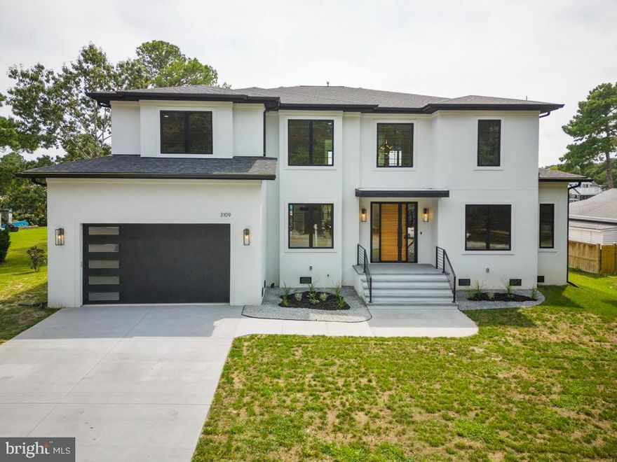 Extraordinary new construction waterfront home w/ modern design, dramatic spaces & generous natural light. Deepwater easy access to bay at one of widest parts of canal. 5 BR/4.5 BATH + Office (or 6th BR, Gym, etc.). 10 FT ceilings on Level 1; 9 FT on Level 2. Two-story foyer & LR w/ wall of windows, sliding glass door, gas FP & built-ins. DR has tray ceiling & art niches. Gourmet Kitchen w/ Decor cabinets, Quartz counters, Wolf range & Subzero fridge. Adjacent Mudroom & Pantry. Plus En Suite BR & stylish Powder Room on Level 1. Owners’ Suite on Level 2 w/ custom closet, lavish bath & balcony. Level 2 has 3 more BRs, 2 Baths & Laundry Rm. Wide plank white oak floors, modern tilework, custom rails, & LED recessed lights. Pella Impervia black casement windows. Oversized garage w/ high ceilings & wired for electric car charger (240 V). Rinnai Tankless Water Heater. Carrier HVAC. Cement board stucco exterior. Trex Composite Decking. Bulkhead (about 8 yrs old) w/ water & electric available.
